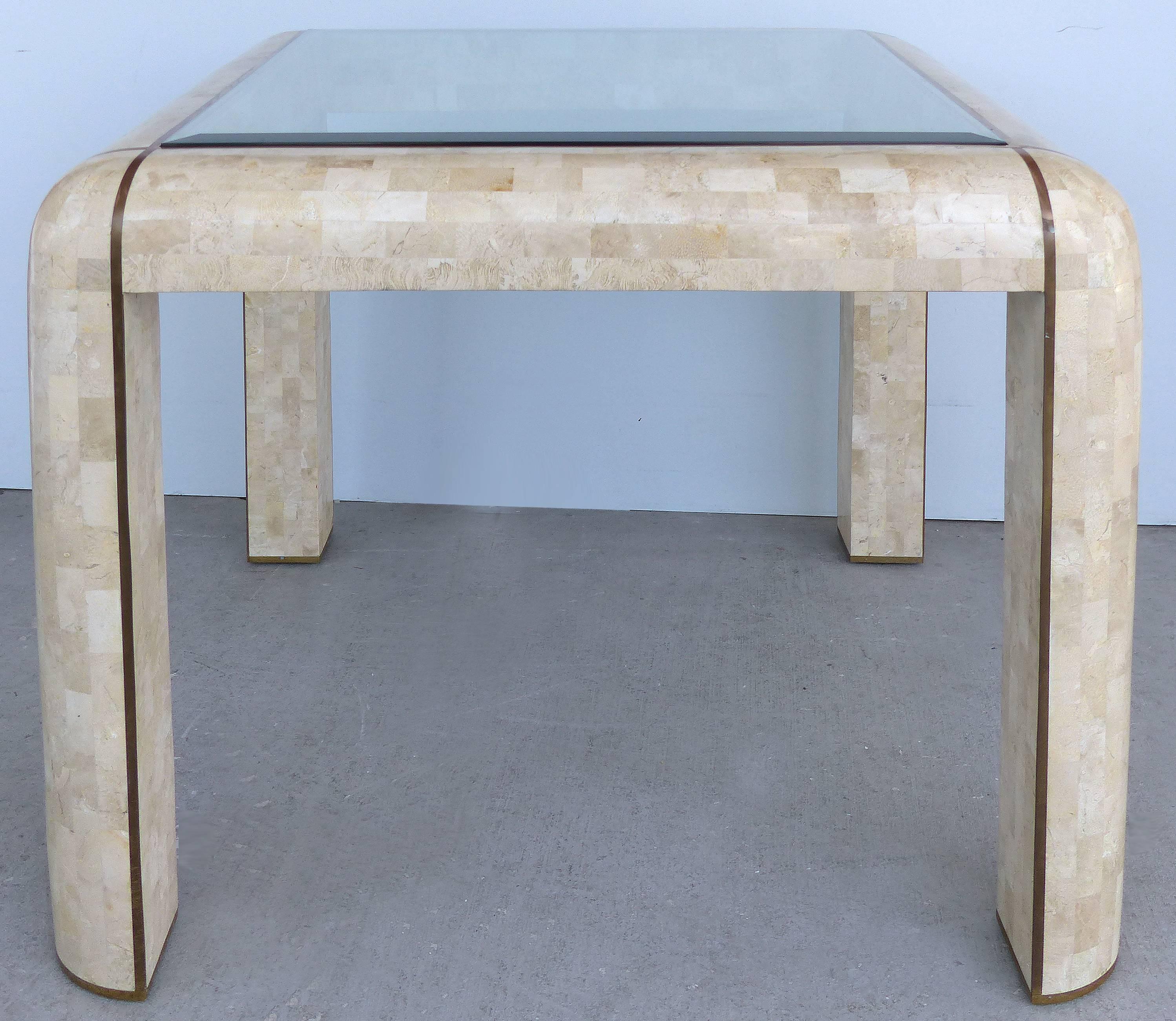 Tessellated Stone and Brass Inlay Dining/Game Table Attributed to Maitland Smith

Offered for sale is a tessellated stone and brass inlay dining/game table attributed to Maitland Smith. The form of the table has a Karl Springer feel. Beveled glass;