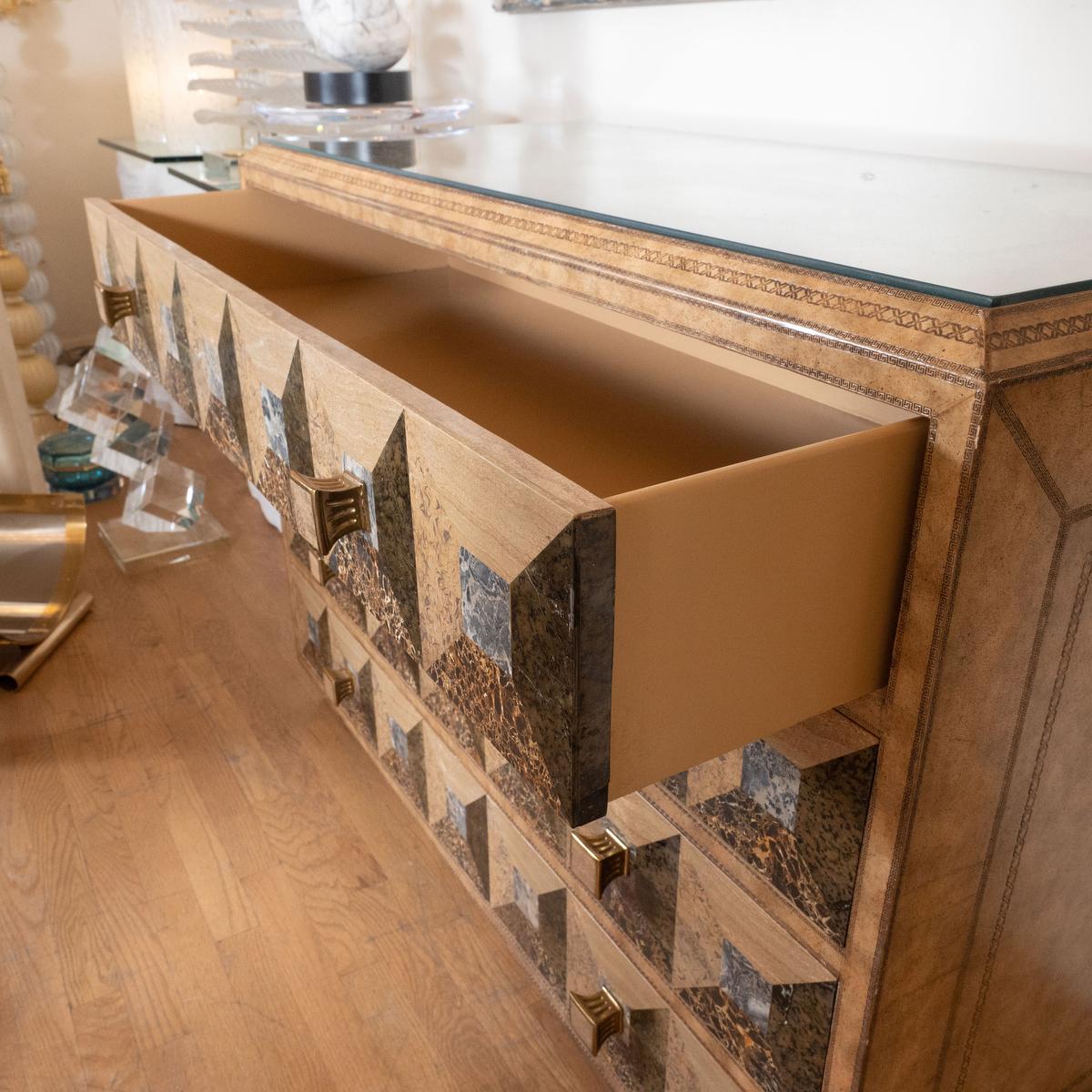 Tessellated stone and leather chest with four drawers by Maitland Smith. Signed.