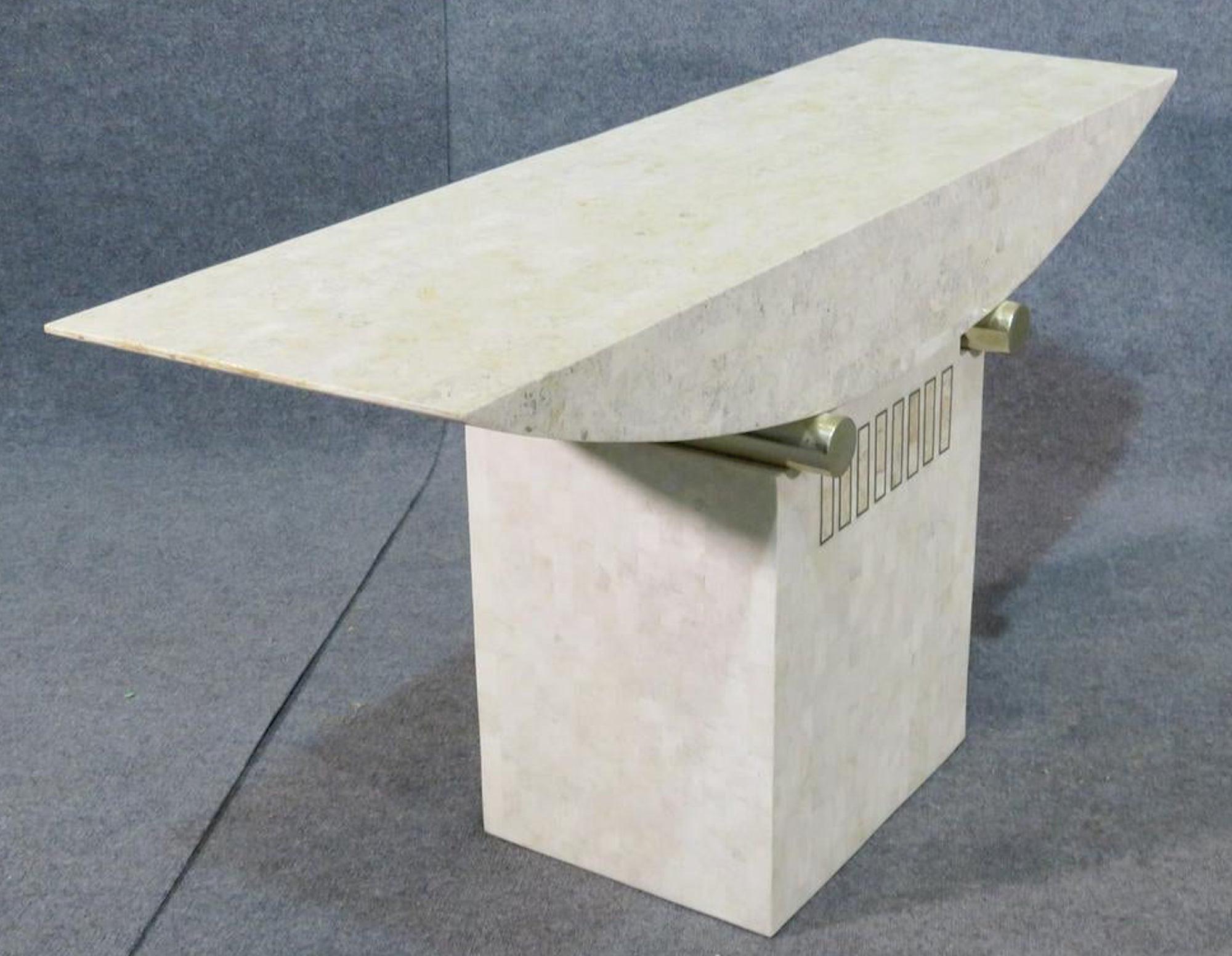 Midcentury console table with tessellated stone and brass accents. Designed by Roland Carter for Casa Bique with fossil stone.
(Please confirm item location - NY or NJ - with dealer).
  