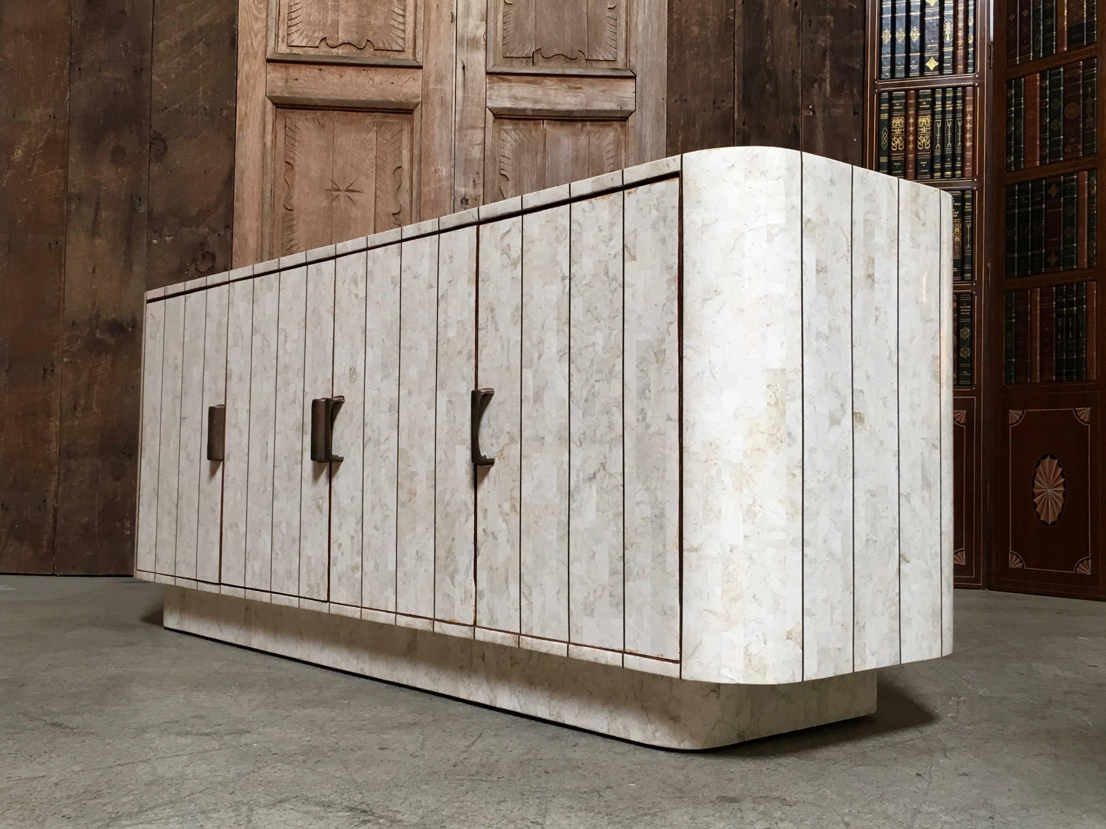 Tessellated stone credenza with brass inlay in the manner of Maitland Smith with chocolate velvet interior.