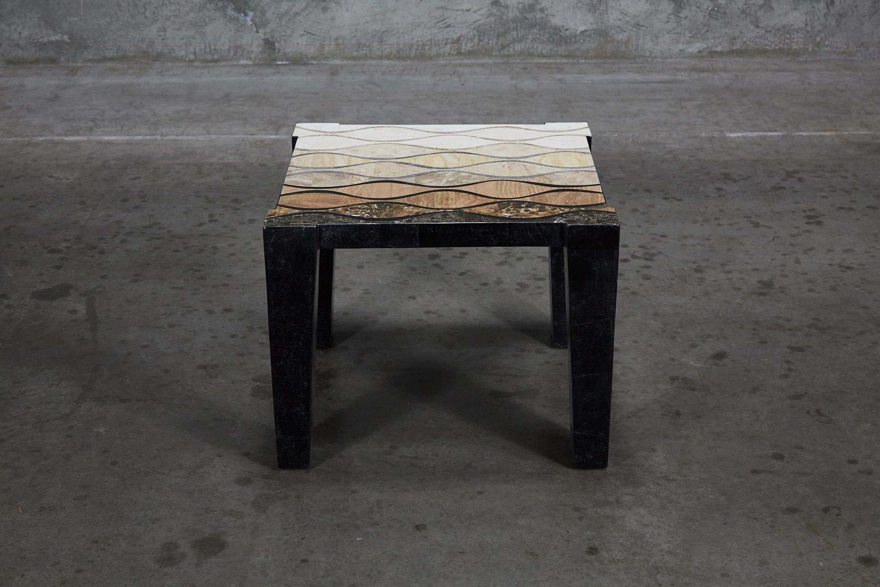 Simple rectilinear side table fully inlaid with tessellated stone. Legs in solid black stone. Tabletop inlaid with stylized wavy pattern executed in snakeskin stone, woodstone and cantor stone inlay. Handmade in the Philippines.

Coordinating