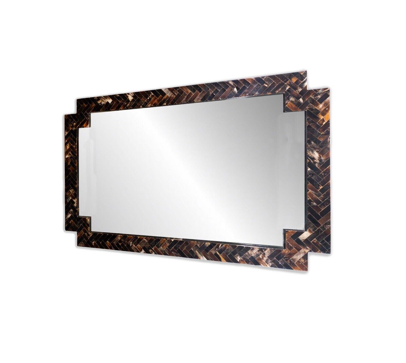 Elevate your living space with this exquisite Tessellated Stone Hanging Mirror, seamlessly blending the opulence of tessellated stone craftsmanship with the sleek lines of Mid Century Modern design. The mirror's horizontal orientation adds a touch