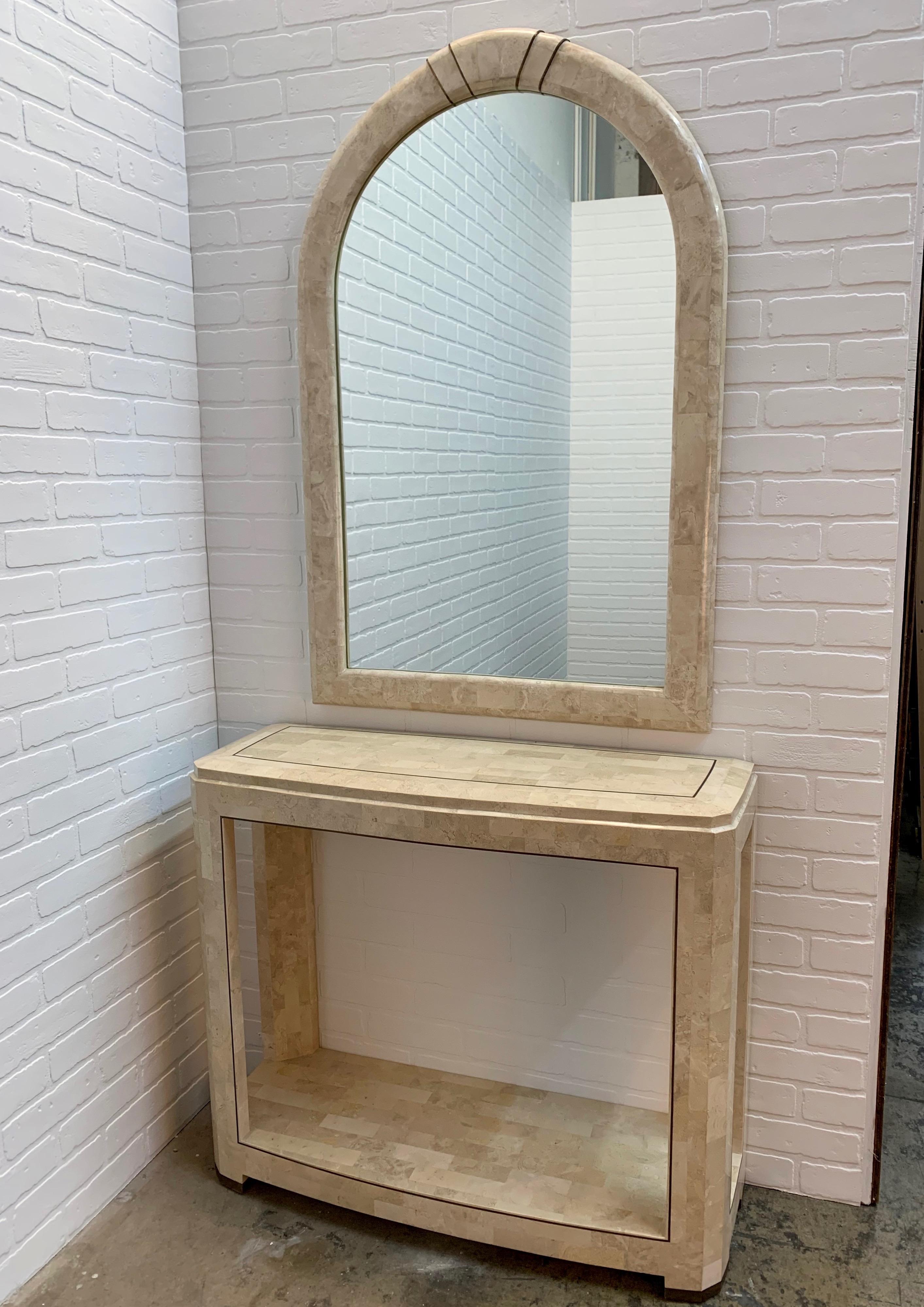 Travertine with brass trim mirror and console in the style of Maitland Smith 1980s 
Table measures 36