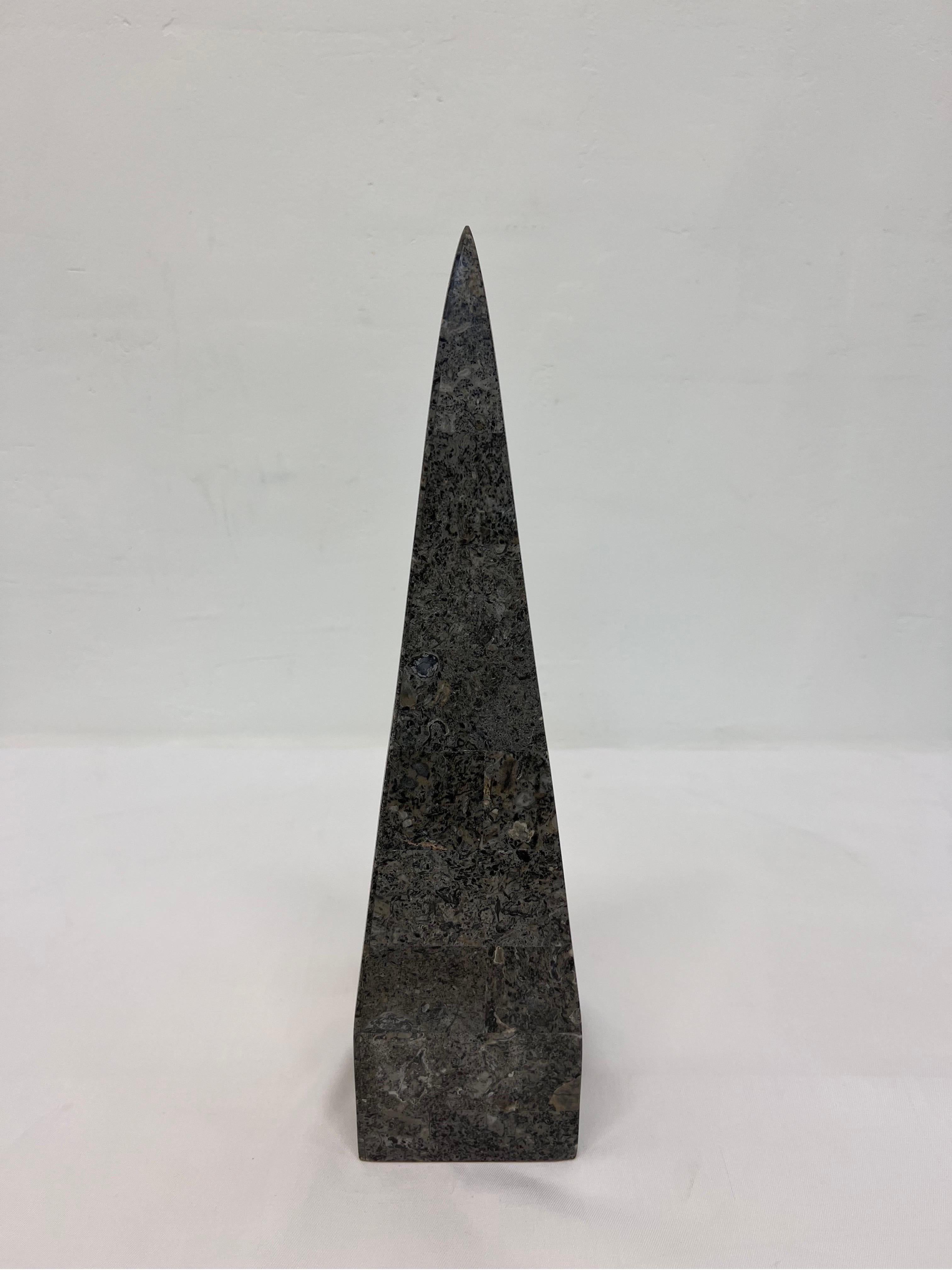 Tessellated grey stone obelisk, circa 1990s.