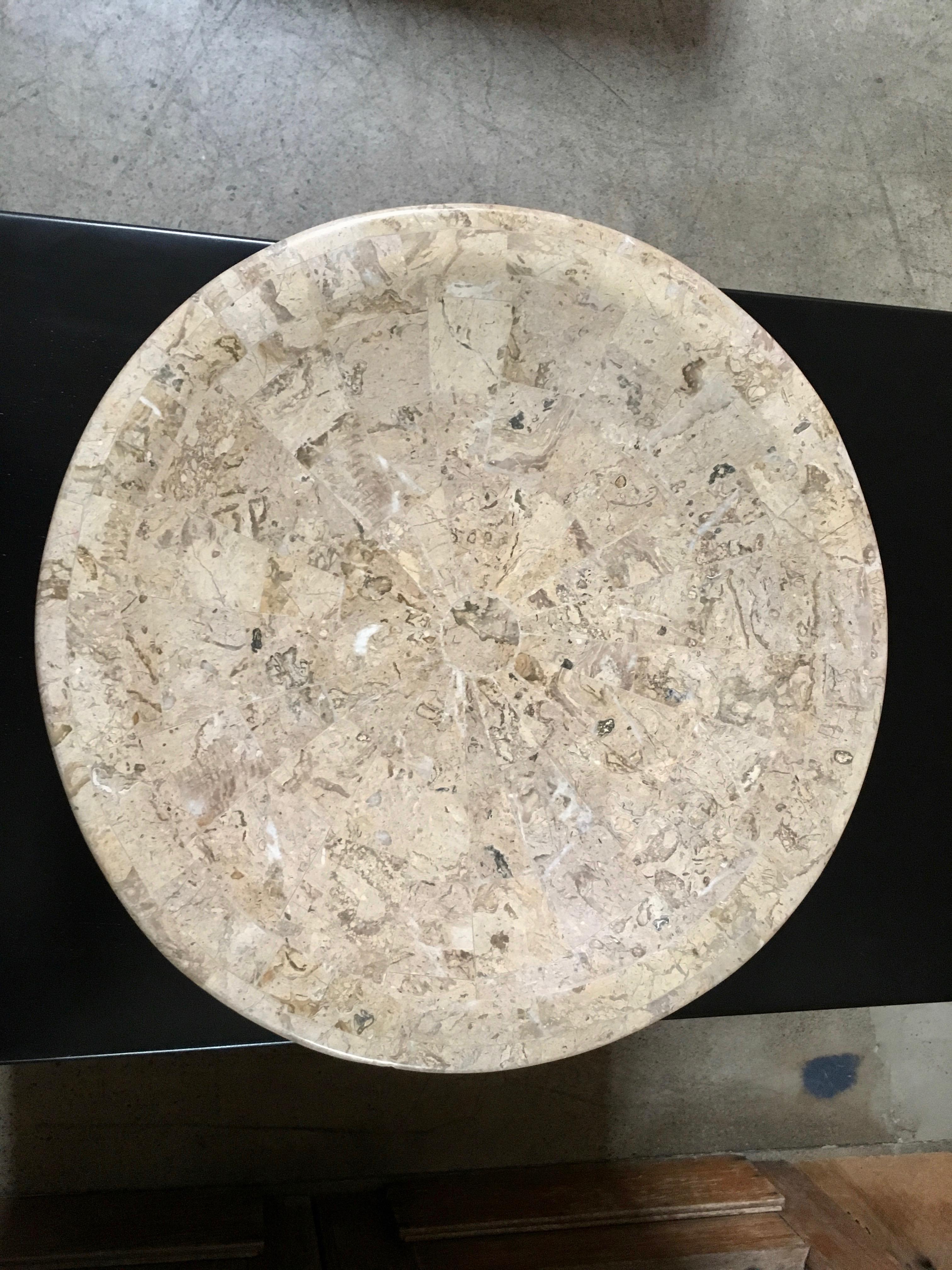 Maitland-Smith style bowl of tessellated travertine in a sunburst design with giltwood feet.