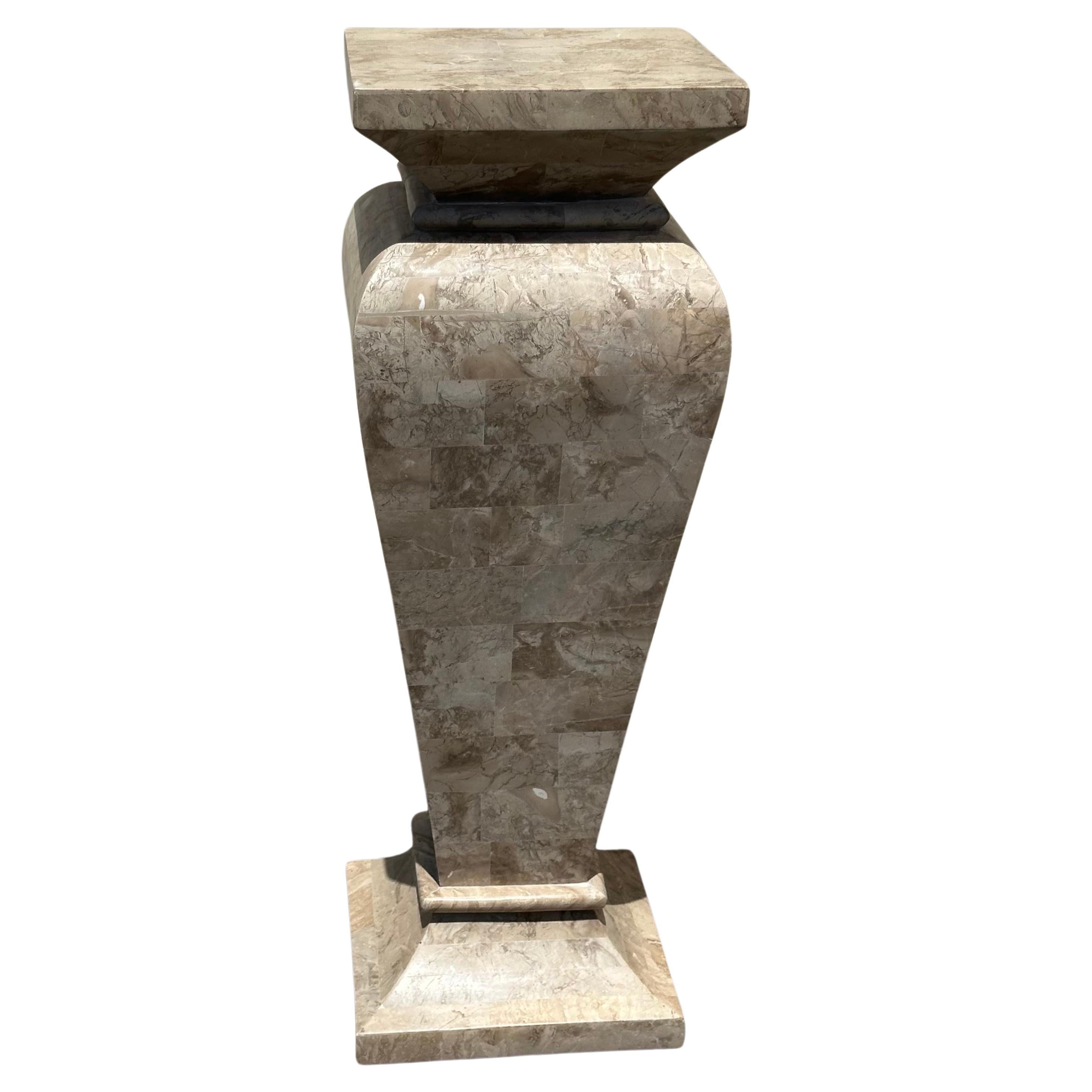 Gorgeous sculptured tessellated stone pedestal in the style of Maitland Smith, circa 1970s.  Well constructed piece in great condition that measures 12