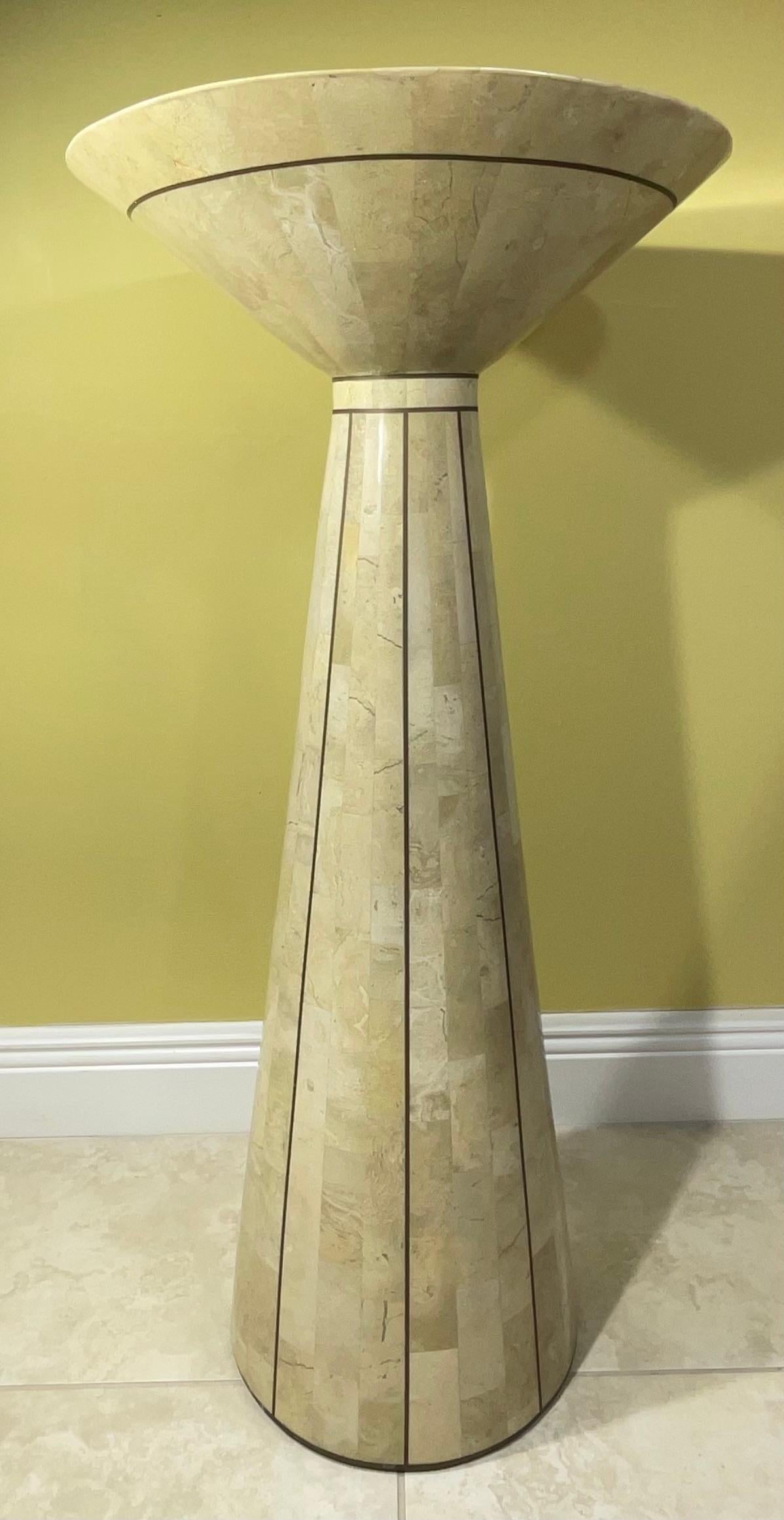 
 Tessellated stone pedestal with brass accents by Maitland Smith, circa 1970s. Beautiful piece in good condition ,The piece was made in the Philippines and can be used as a pedestal for decorative object of art .