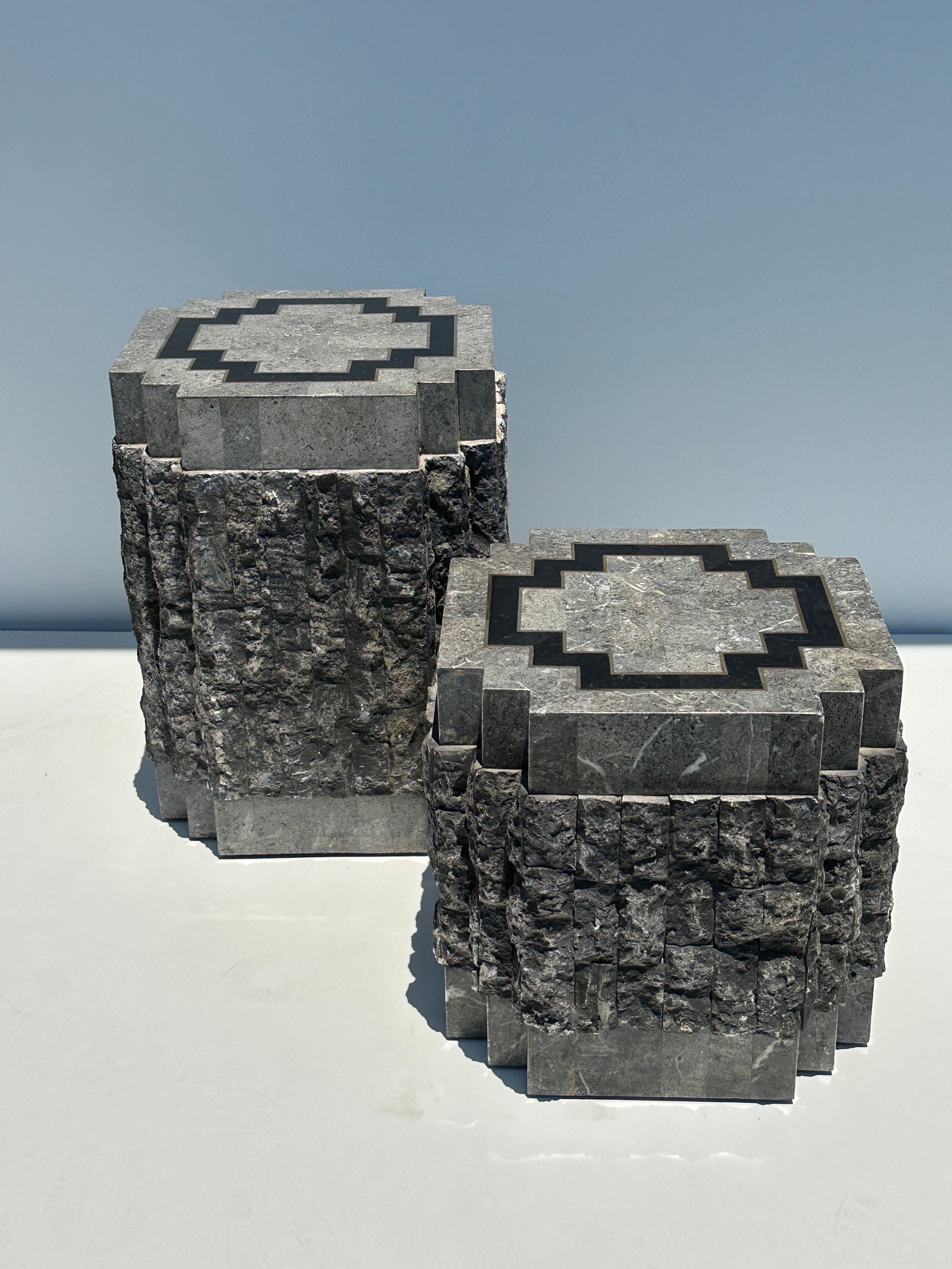 Pair of Brutalist style tessellated stone side / end tables with brass trim in the style of Maitland Smith. 
Large is 20.5” x 16” x 16
Small is 15” x 16” x 16”