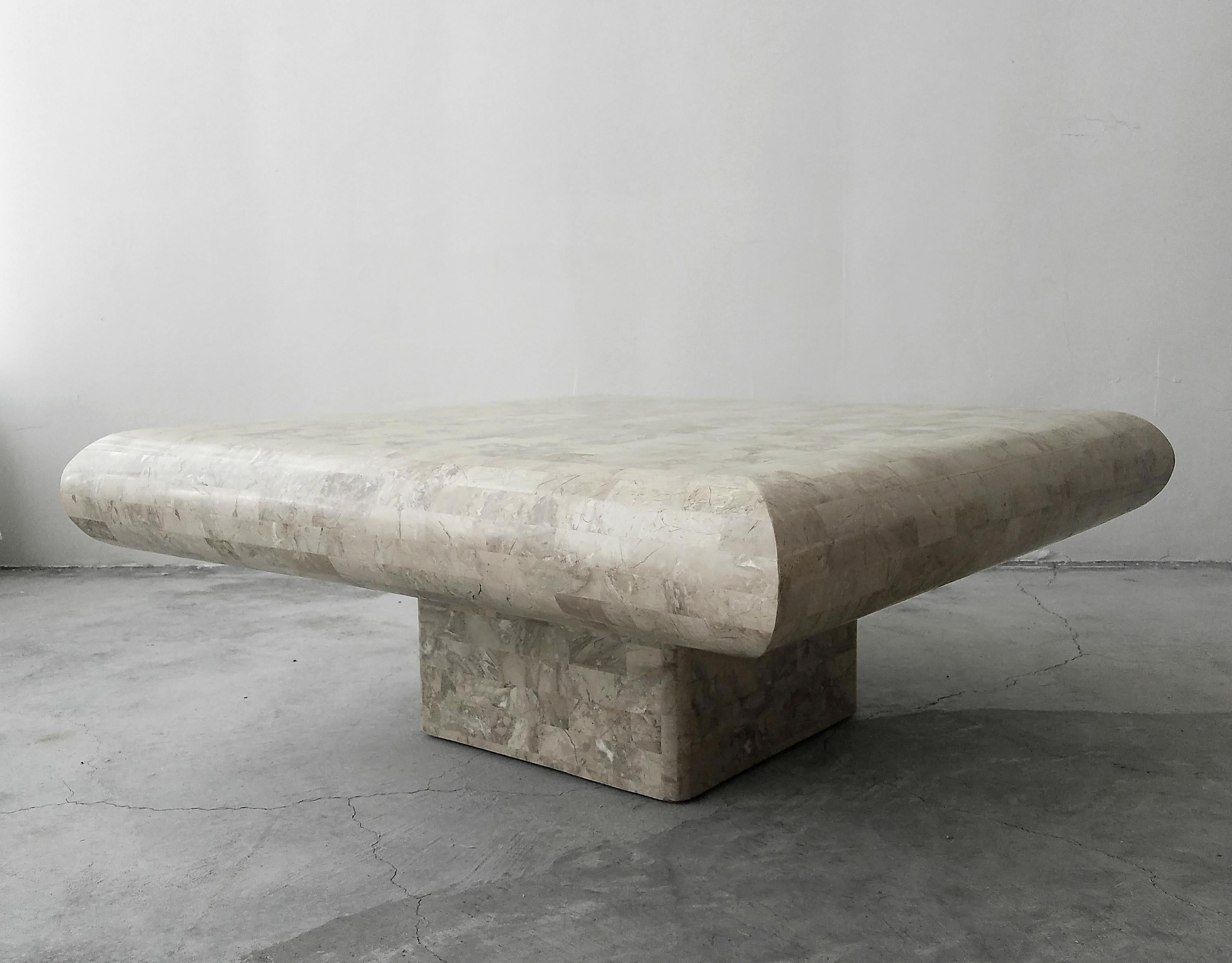 Unique tessellated stone pedestal coffee table by Maitland-Smith. Clean, simple, organic design.

Table is in excellent condition.
