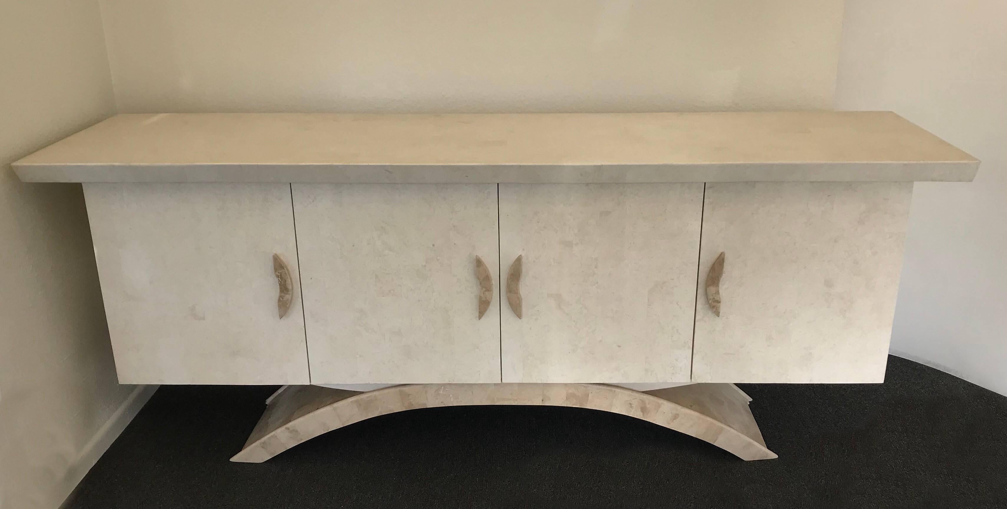 A spectacular 1980s tessellated travertine and fossil handles with a off-white lacquer interior cabinet by Marquis Collection of Beverly Hills.
Dimensions: 85” wide 23.5” deep 34.25” high.