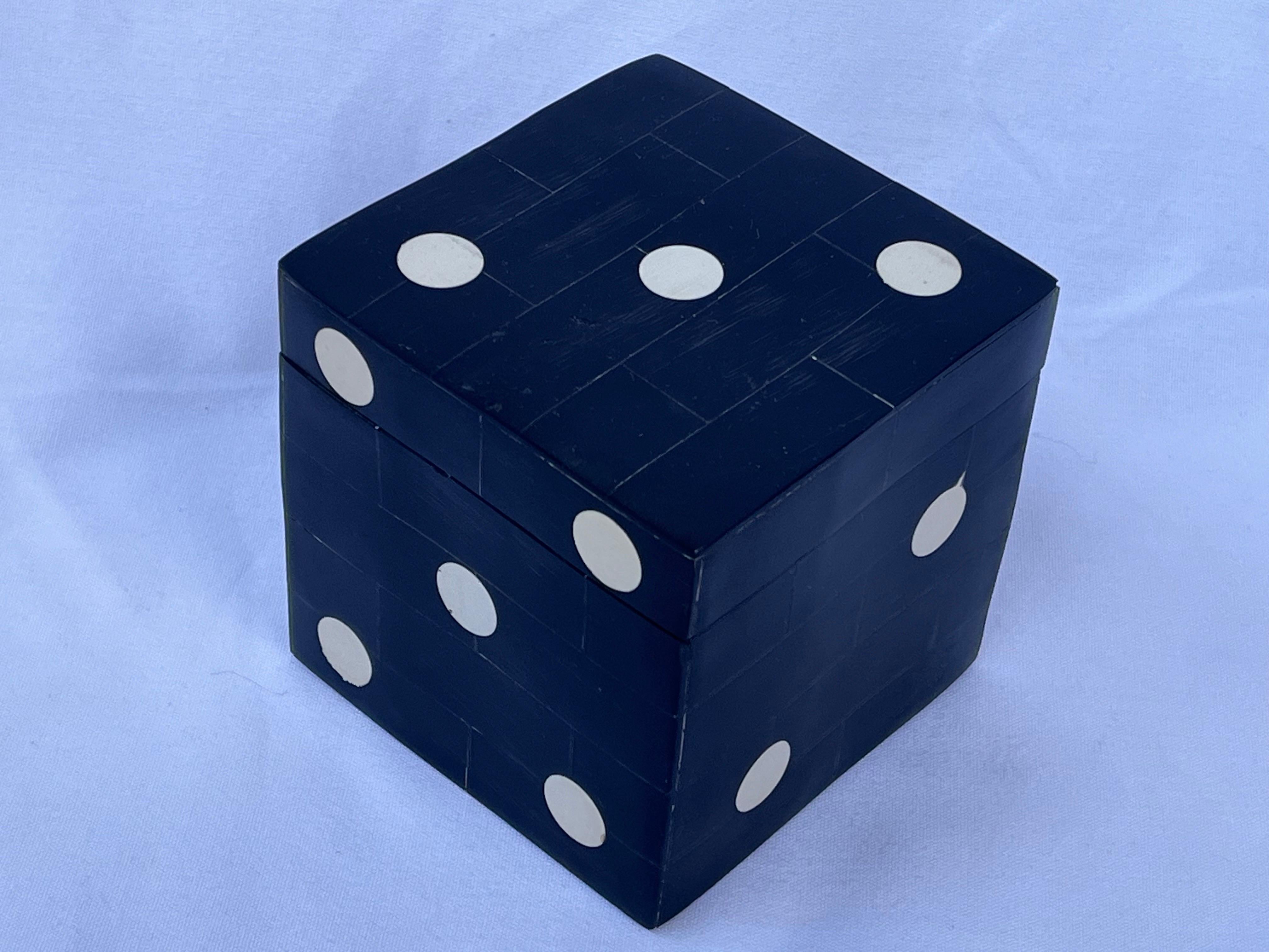Are you feeling lucky? Then roll this die. Luck be a lady tonight. This beautifully crafted tessellated dyed bone lidded box perfectly emulates the titillation of rolling the dice, taking those chances and reaping those rewards. The stylized die /
