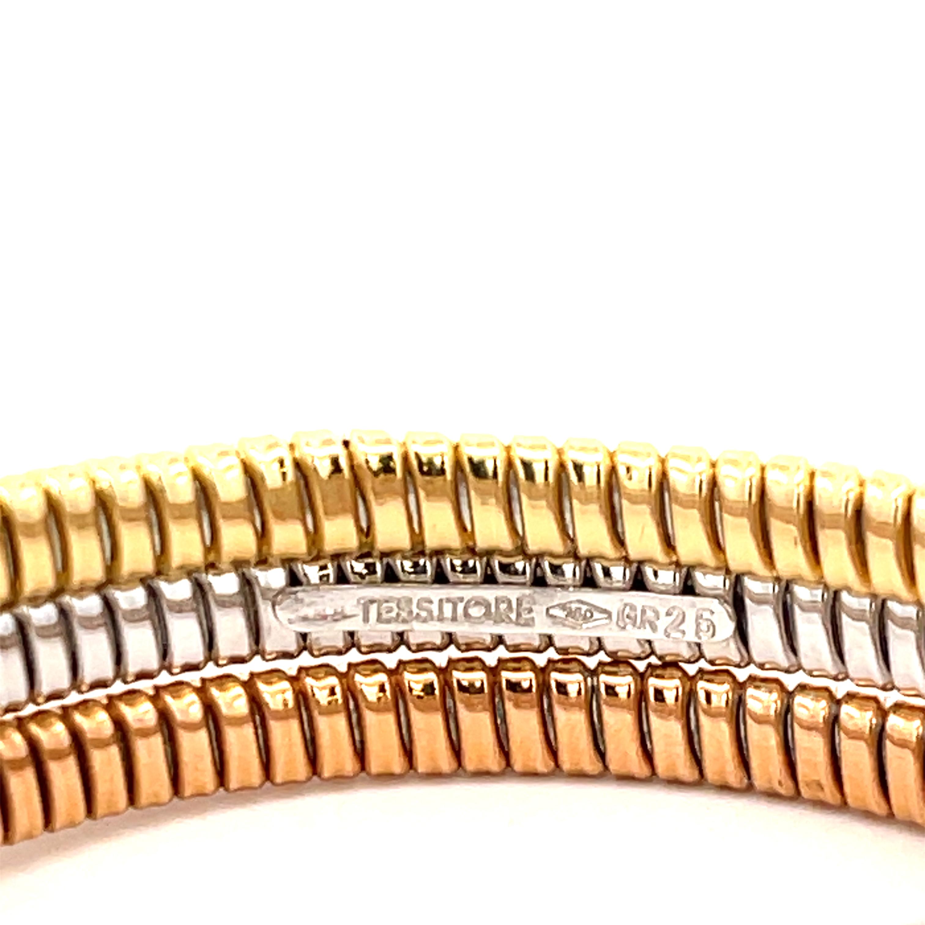 Estate Tessitore Tri-Gold Cable Wrap Bracelet in 18K Gold. Size 7, flexible.
44.8 Grams
1