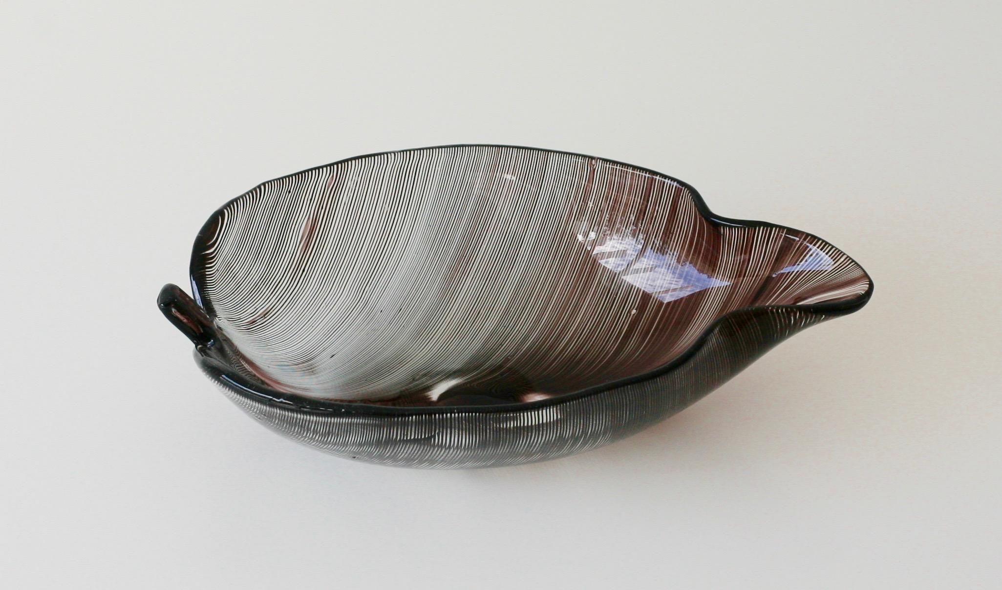 Very early glass bowl designed by Tyra Lundgren for Venini. The so called Foglia filigrana was among her first designs when she started at Venini in 1937. Carlo Scarpa was responsible for the pattern. This bowl is signed with the two line acid stamp