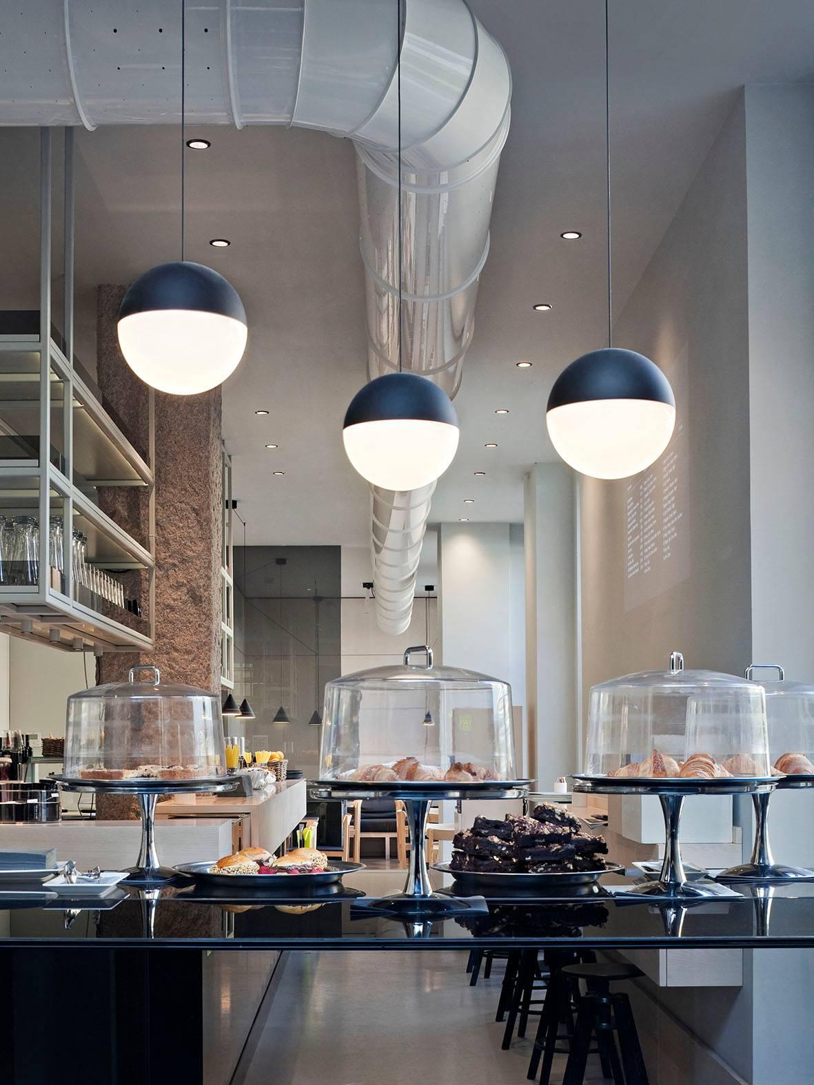 A play of graceful light overhead, String Lights by Michael Anastassiades adds a streamlined sophistication to your home or office. Providing diffused light, the suspension lamp features a matte black varnished die-cast aluminum body coated with