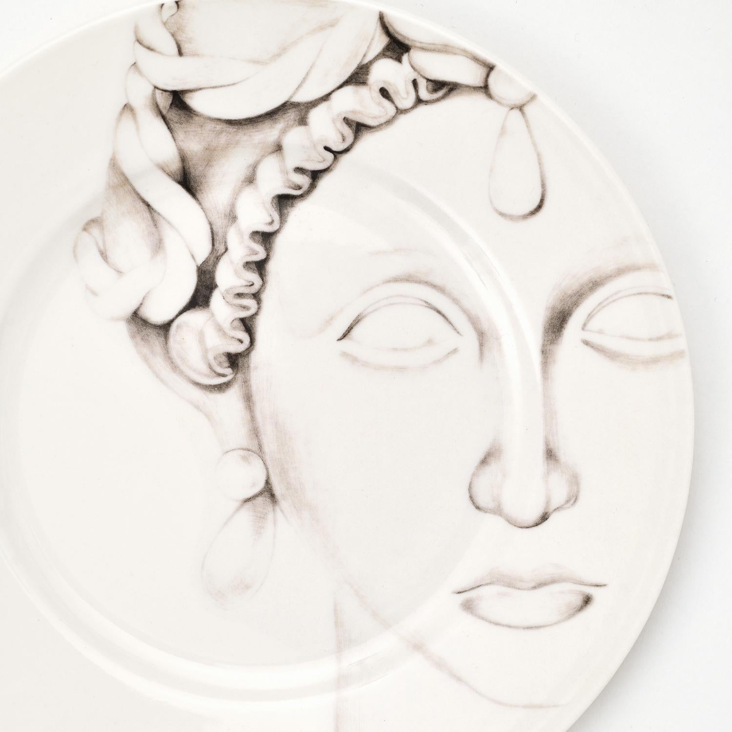 These captivating Catalina dessert plate belongs to the Teste di Moro Collection of truly unique Italian dining ware. Inspired by the Sicilian Moor's Head tradition, these incredibly detailed plates are entirely handcrafted in refined porcelain.