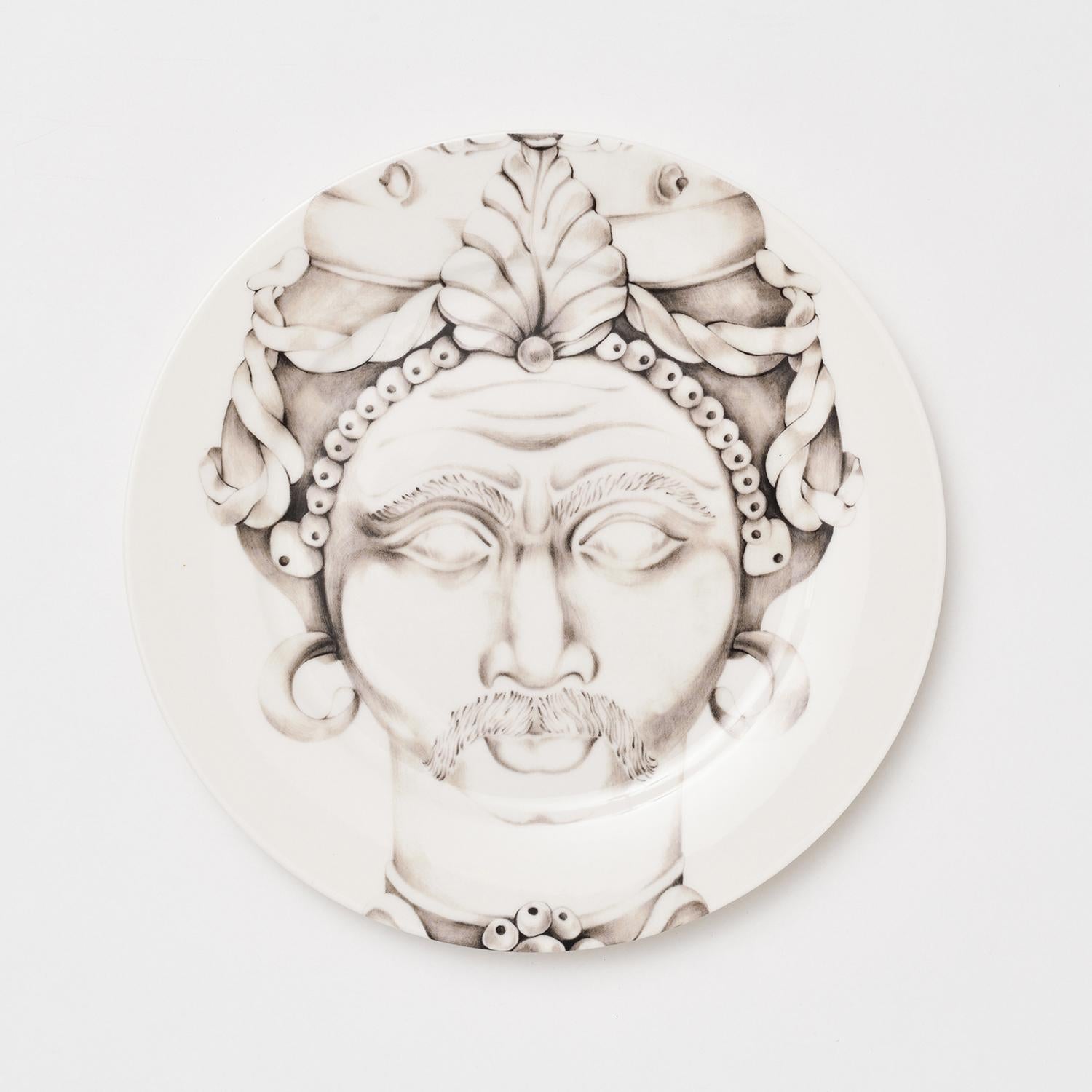 These captivating Alejandro dinner plates belong to the Teste di Moro Collection of truly unique Italian dining ware. Inspired by the Sicilian Moor's Head tradition, these incredibly detailed plates are entirely handcrafted in refined porcelain.