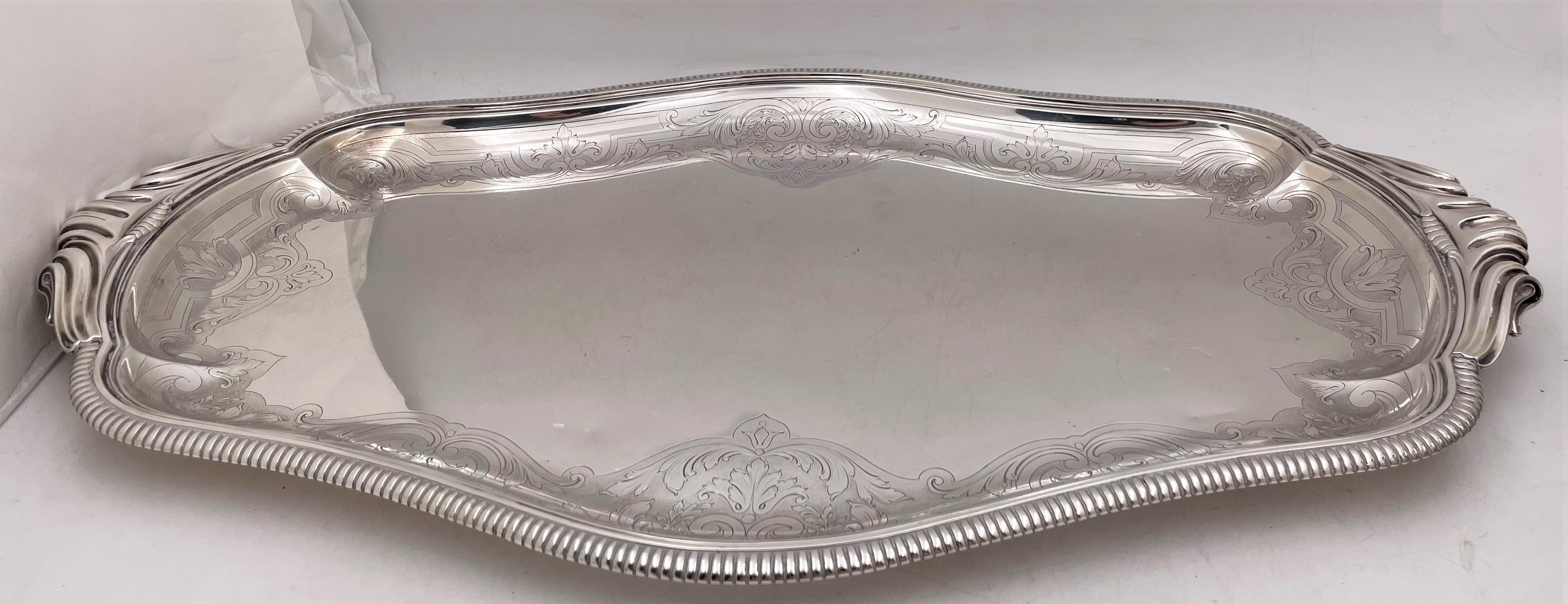 Tetard, French 0.950 (higher purity than sterling) silver 7-piece tea set, beautifully adorned with curvilinear and stylized natural motifs and well-rendered faces, in Art Deco style, presumably from the early 20th century, consisting of:

- a
