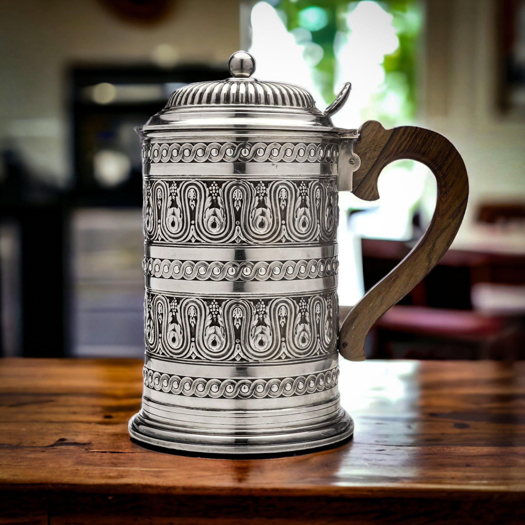 Antique highly ornate embossed 800. French silver tankard by Tétard Frères.
Made in France, circa 1910s
Fully hallmarked with maker's mark on base and Minerva 800. silver hallmark on upper rim.

The dimensions:
Diameter x height: 12 x 20
