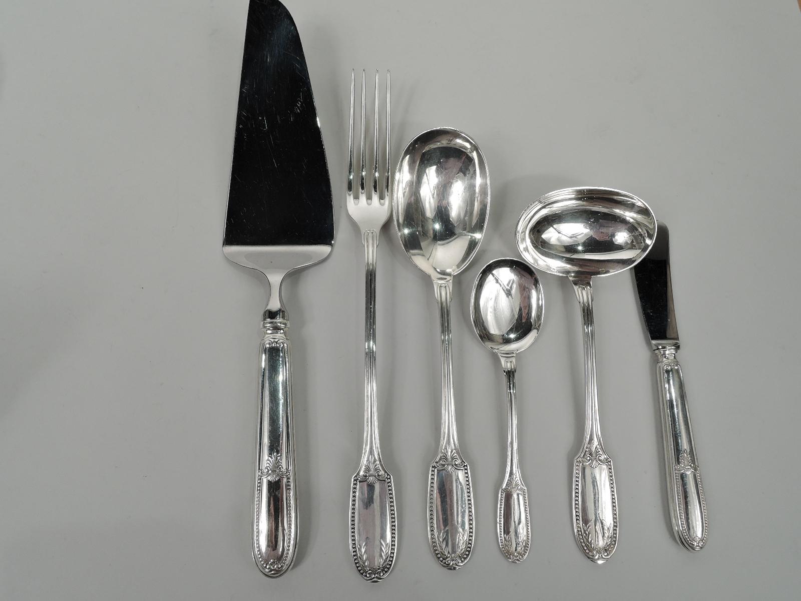 La Rochelle silver dinner set for 12. Made by Tetard Frères in France. This set comprises 90 pieces (dimensions in inches):

Knives: 12 dinner knives (9 3/4) and 12 fish knives (8 1/8);

Forks: 12 dinner forks (8 1/4), 12 dessert forks (6 7/8),