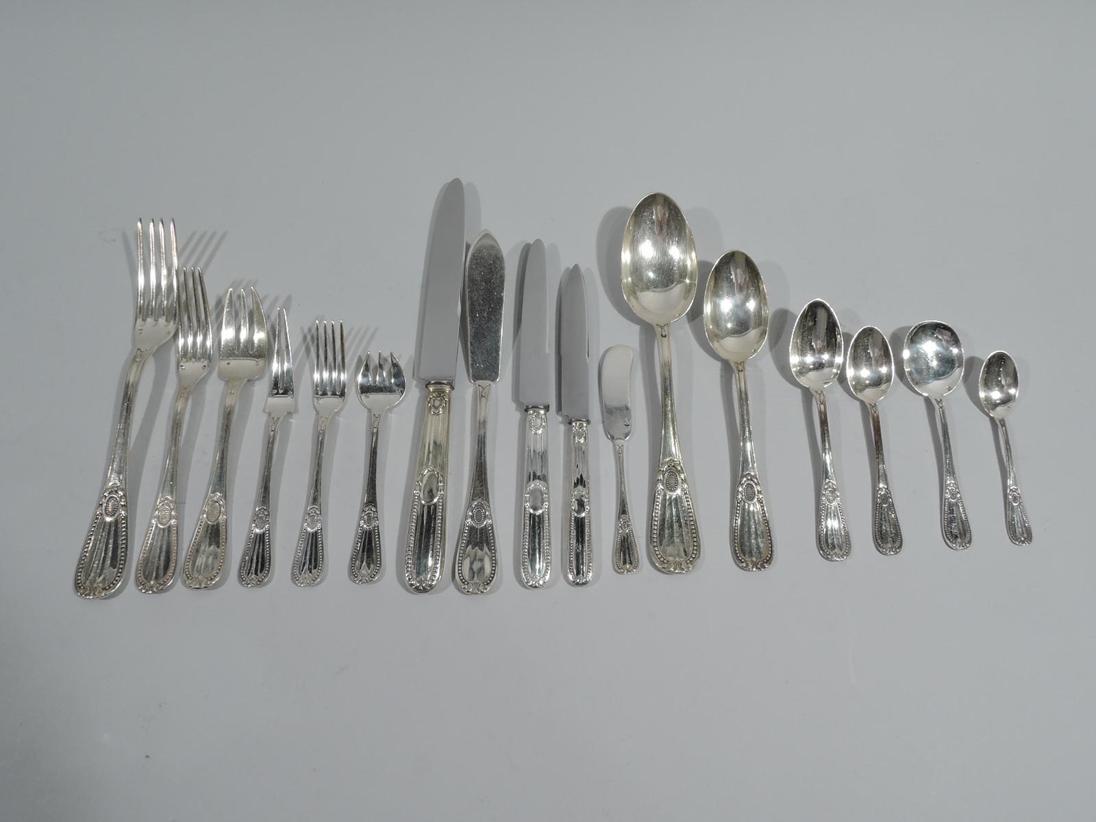 Perles 950 silver dinner and lunch set for 24. Made by Tetard Frères in France. This set comprises 474 pieces (dimensions in inches):

Forks: 24 dinner forks (8 1/2), 22 lunch forks (7), 24 fish forks (6 5/8), 24 seafood forks (5), 24 dessert