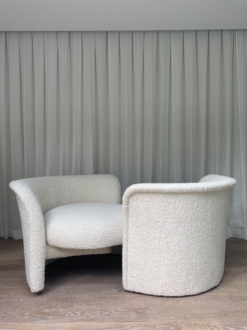 Tete A Tete sofa designed by Milo Baughman. 

Measures: 28 x 64 x 44 in

Newly reupholstered in a natural tone bouclé style sherpa fabric. Pivoting arm to transform shape of the sofa. 
 
 