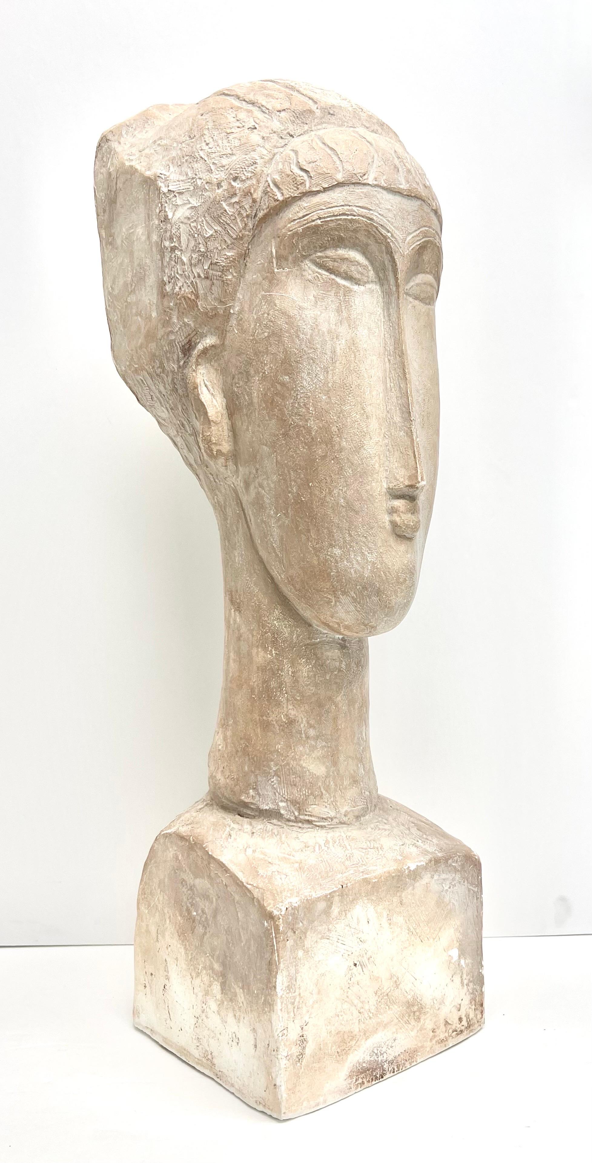 This is a large plaster sculpture after Modigliani. Very nice texture and detail. Made by Austin Prod. circa 1961. Signed on back.