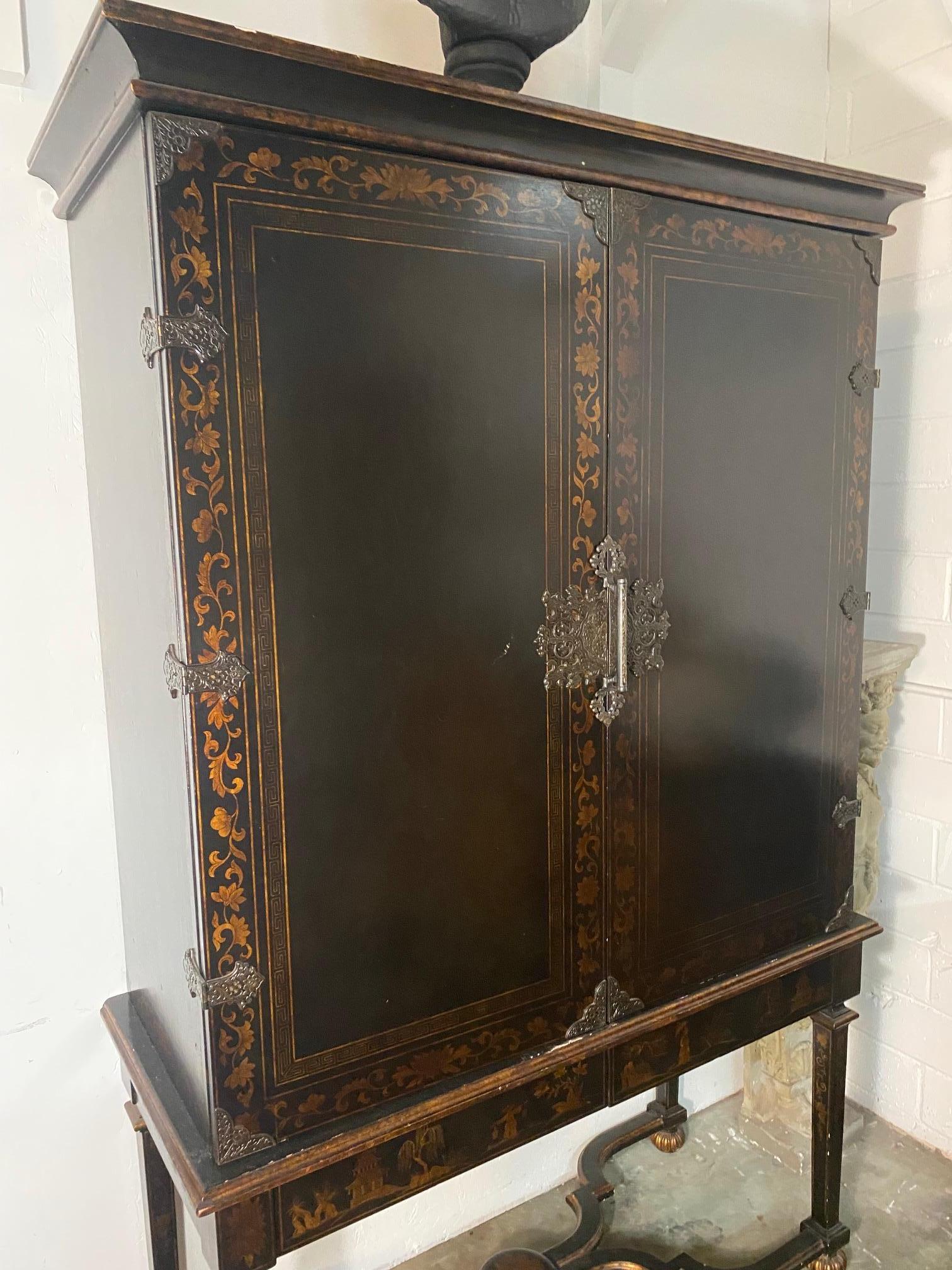 Introducing an exquisite Tete De Négre Chinoiserie TV and Media Cabinet/Armoire, a stunning piece of furniture that combines modern functionality with classic style. Hand-crafted from the finest alder wood, this armoire is designed to accommodate a