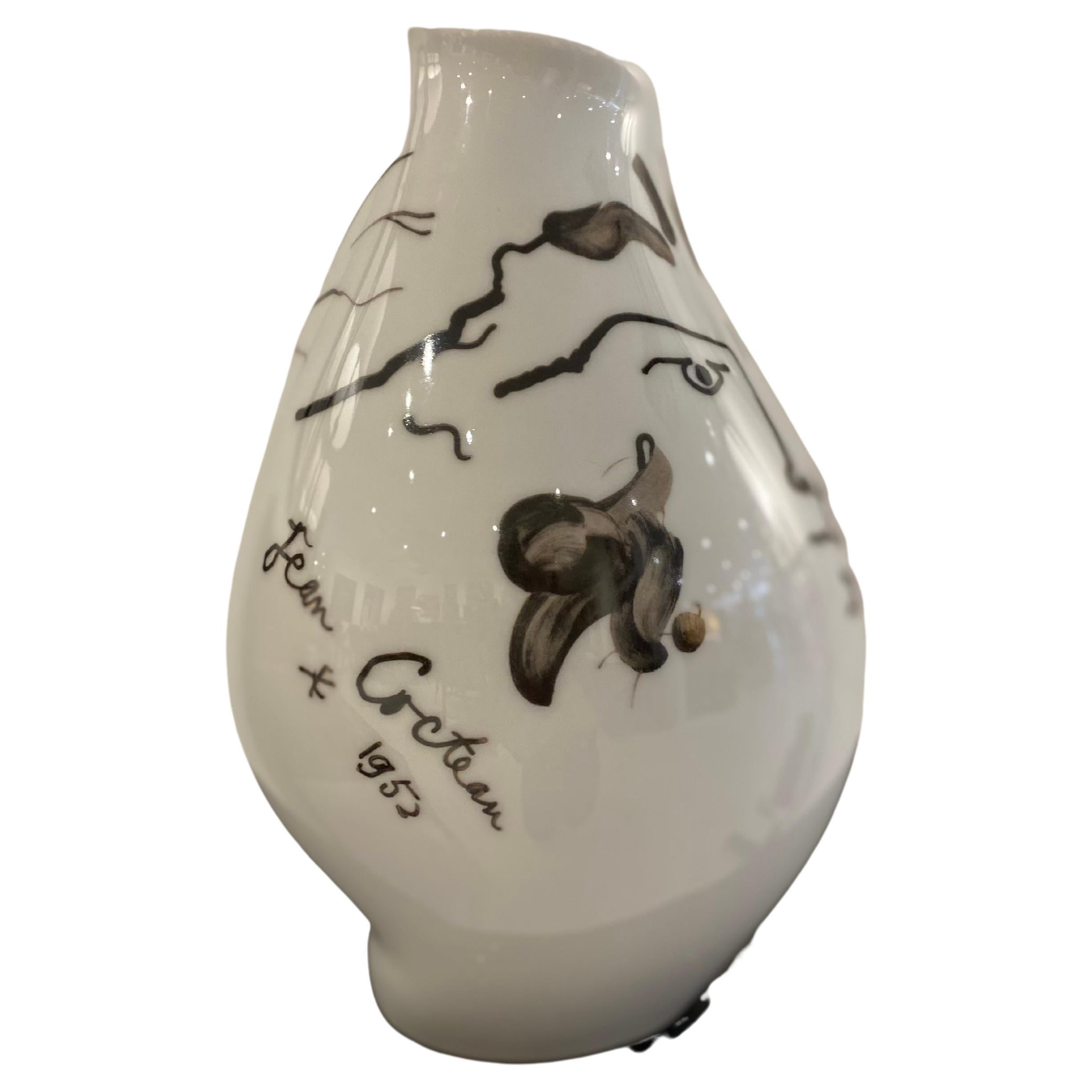 This is beautiful porcelain vase designed by Jean Cocteau for Rosenthal. The piece is in overall wonderful condition. The use and implication of irregular shapes throughout the piece is a quintessential aspect of Cocteau's work. The freeform vase