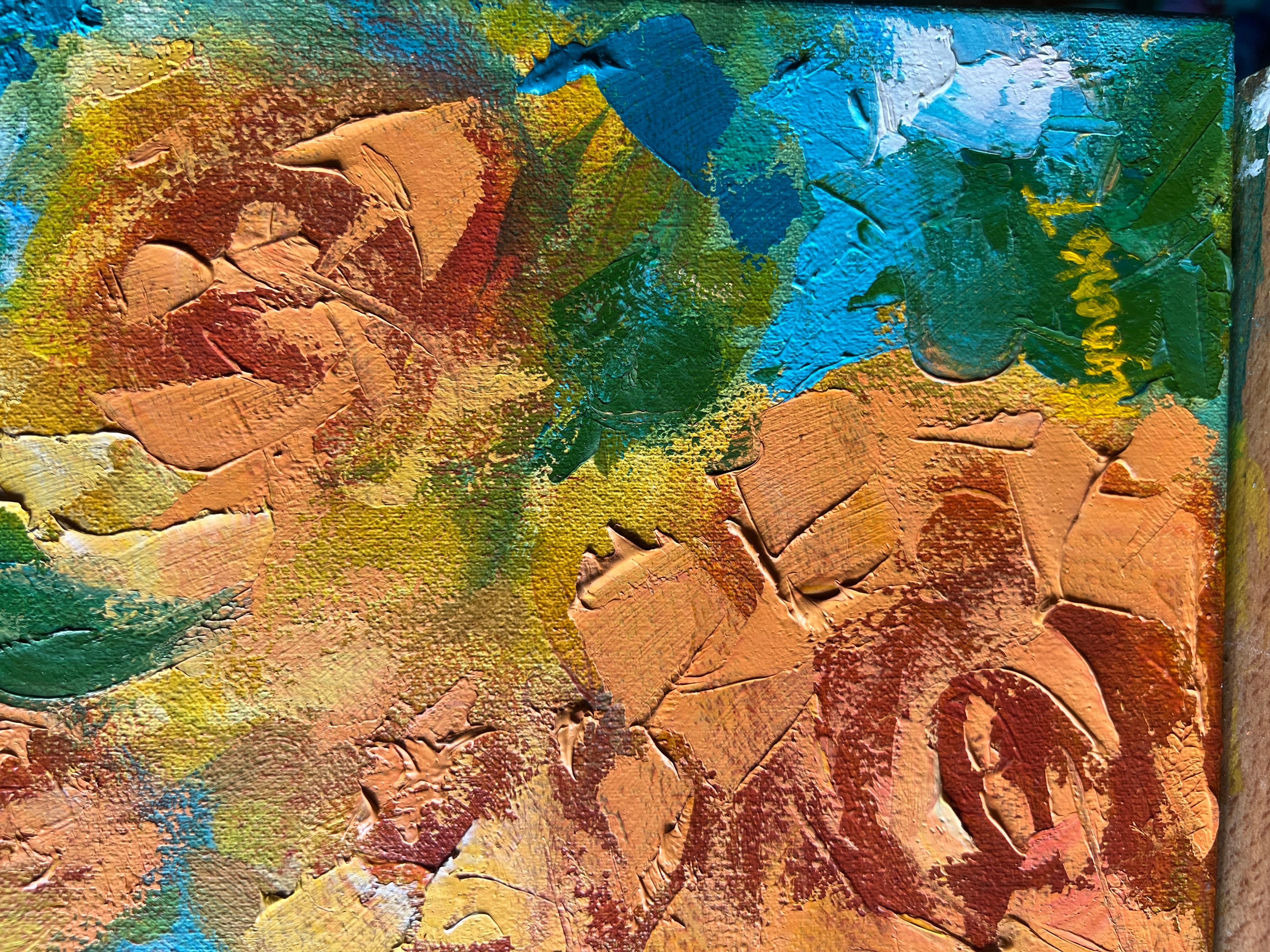 On a serene blue background, vibrant yellow roses are depicted with textured brushstrokes in oil paint. The striking contrast between the blue backdrop and the yellow flowers creates a captivating visual effect. This painting radiates joy and