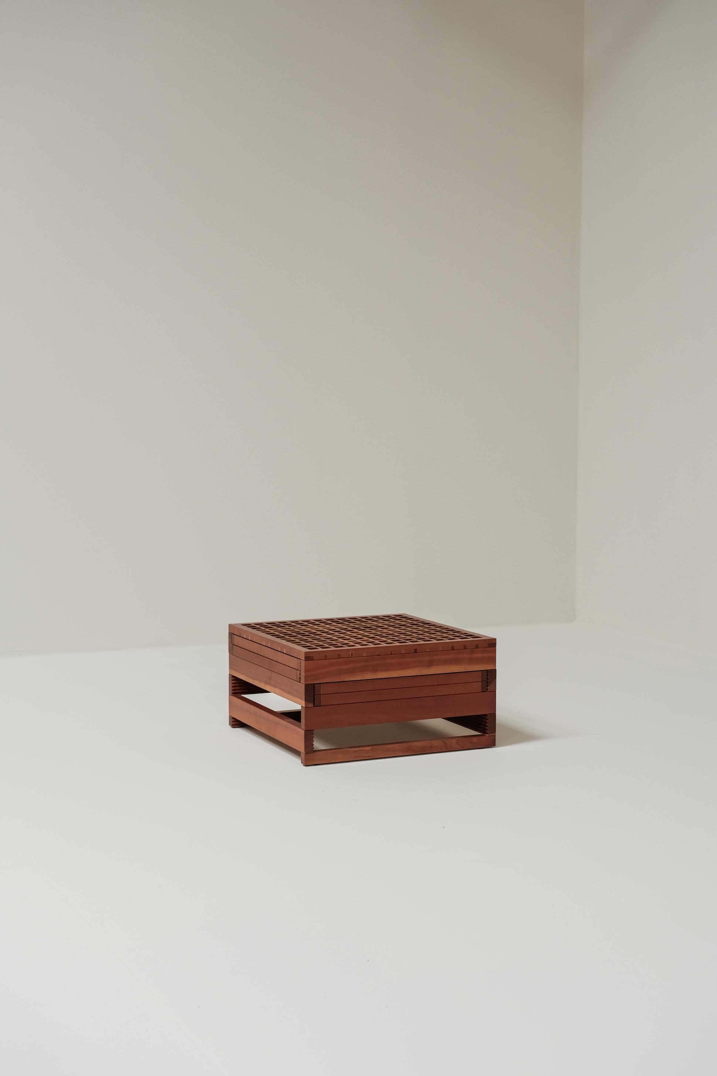 This playful and modular coffee table was designed in Italy around 1970 by Bernard Vuarnesson. 
The cube made out of beech wood works perfectly together with the white creme formatica tops of the modular pieces at the side!