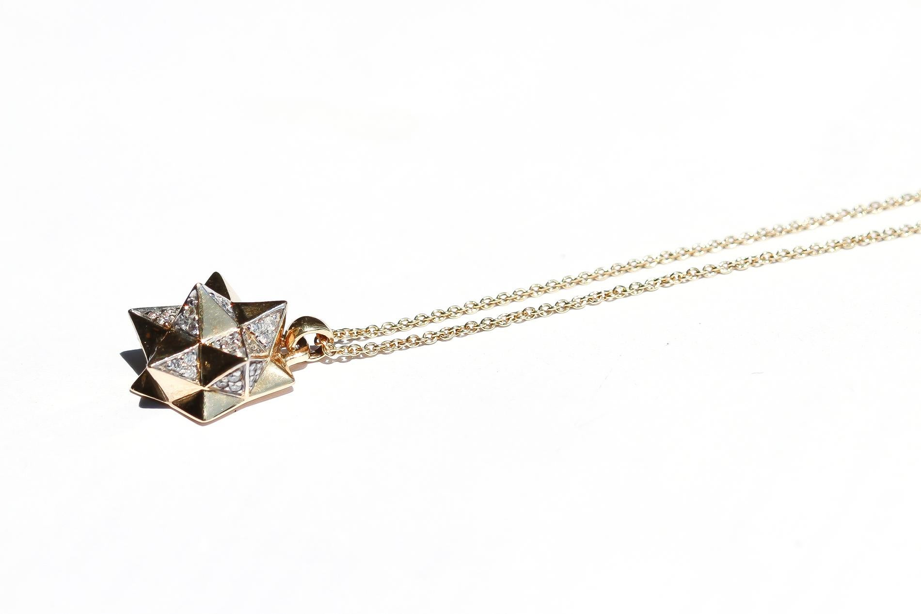 This limited edition, Tetra Diamond Necklace is an embodiment of monumental power and strength. This limited edition necklace by John Brevard is inspired by sacred geometry, namely the star tetrahedron. This necklace features sacred geometric forms