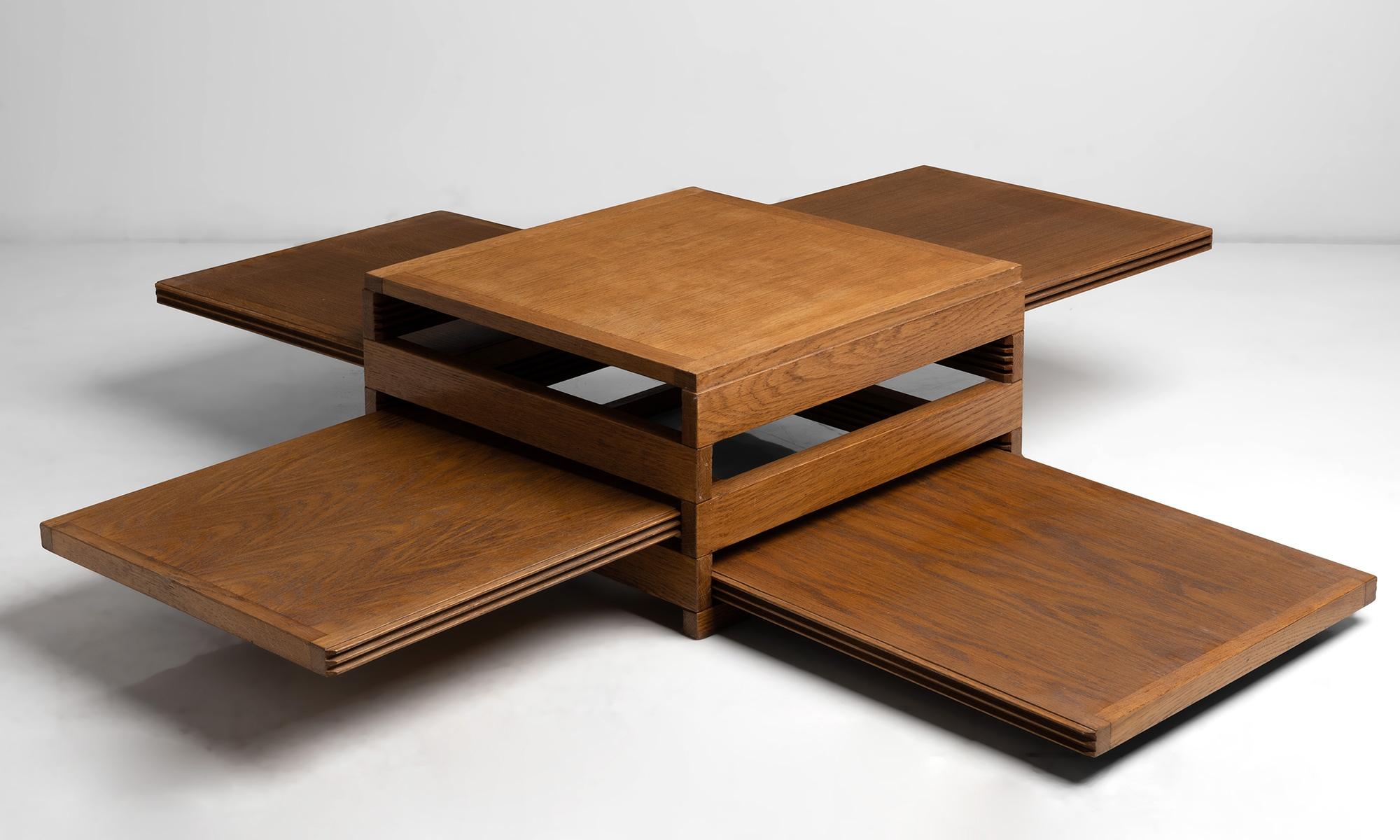 Tetra Legno coffee table by Bernard Vuarnesson.

France, Circa 1970.

Folding and retractable top system in solid oak.

Measures: 62