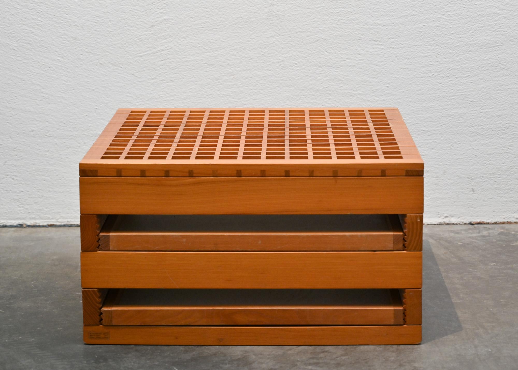 Tetra coffee table designed by by Bernard Vuarnesson with solid wood structure and four reversible trays.‎ The upper part consists of a solid wood grating top.‎ The top support side is laminate finished, with a solid wood frame on the edge, and