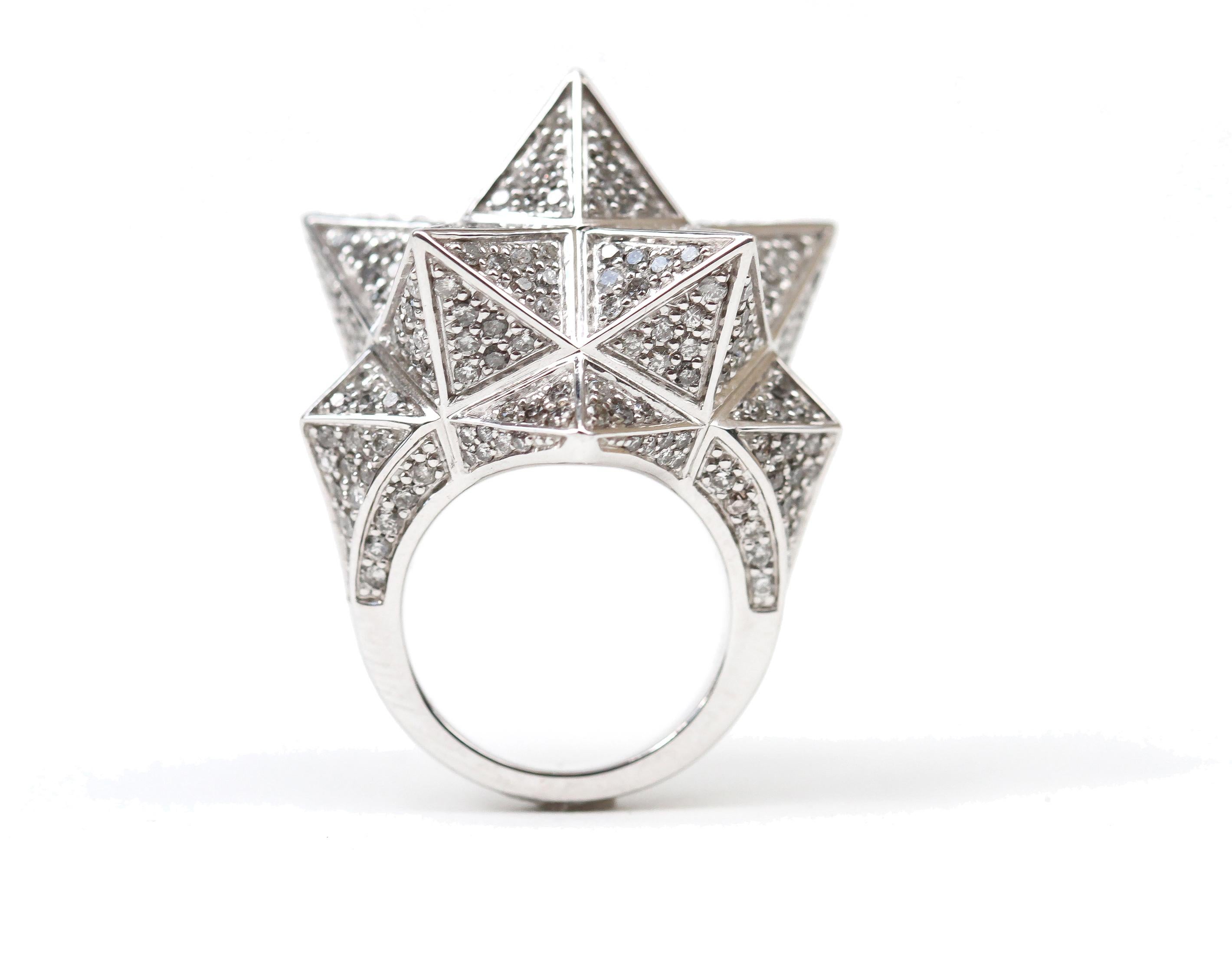 Inspired by sacred geometries, namely the Star Tetrahedron, this John Brevard statement ring is created in 18K white gold with 352 pavé round gray diamonds at 1.0 -1.5 mm each (4.8 carats total). The star tetrahedron is the intersection of two