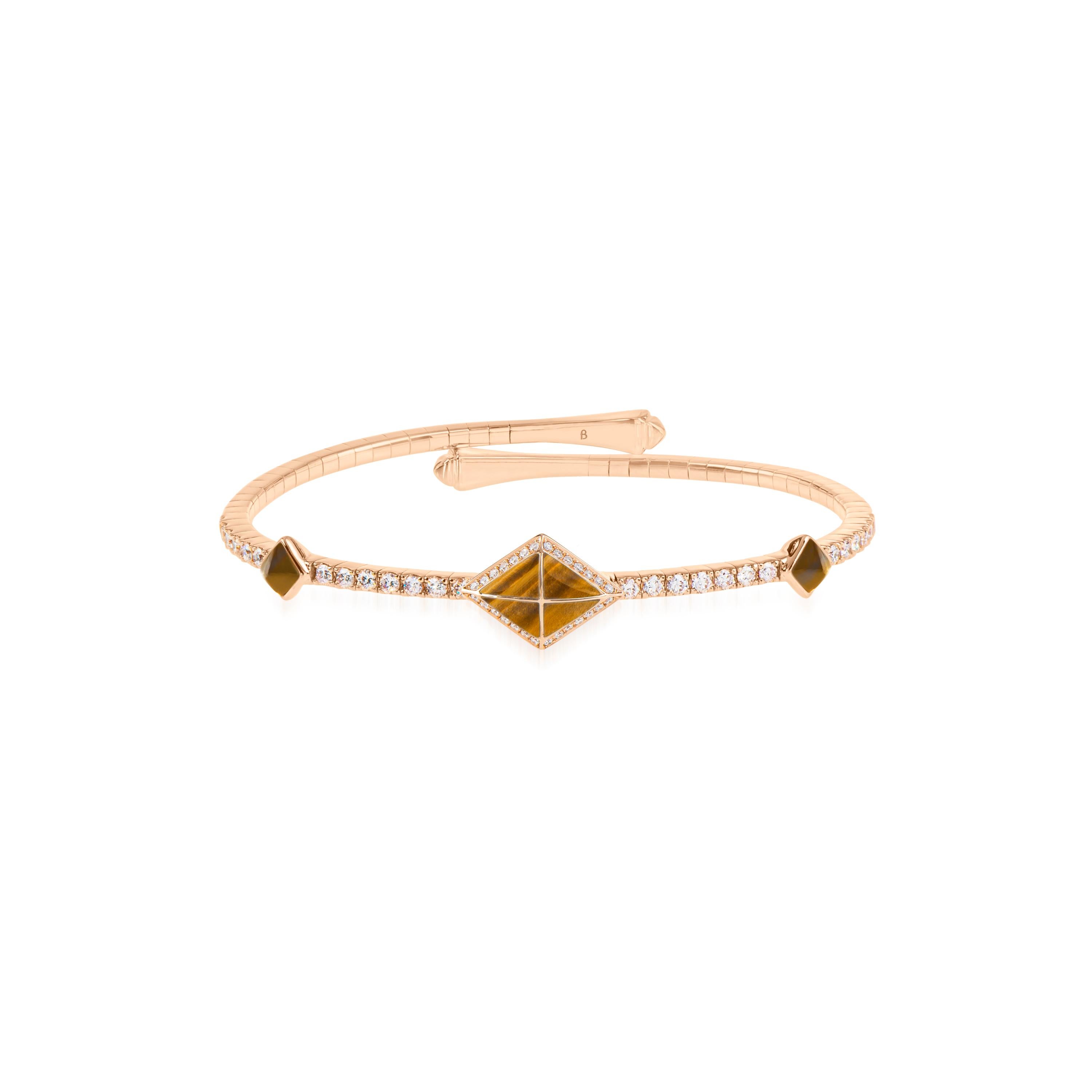 Through graphic, contemporary lines, Butani’s Tetra collection celebrates the beauty of symmetry while reimagining classic motifs of the past. 

Offering a simple elegance, the Tetra Zenith Bangle features a distinctive rhombus motif that gleams