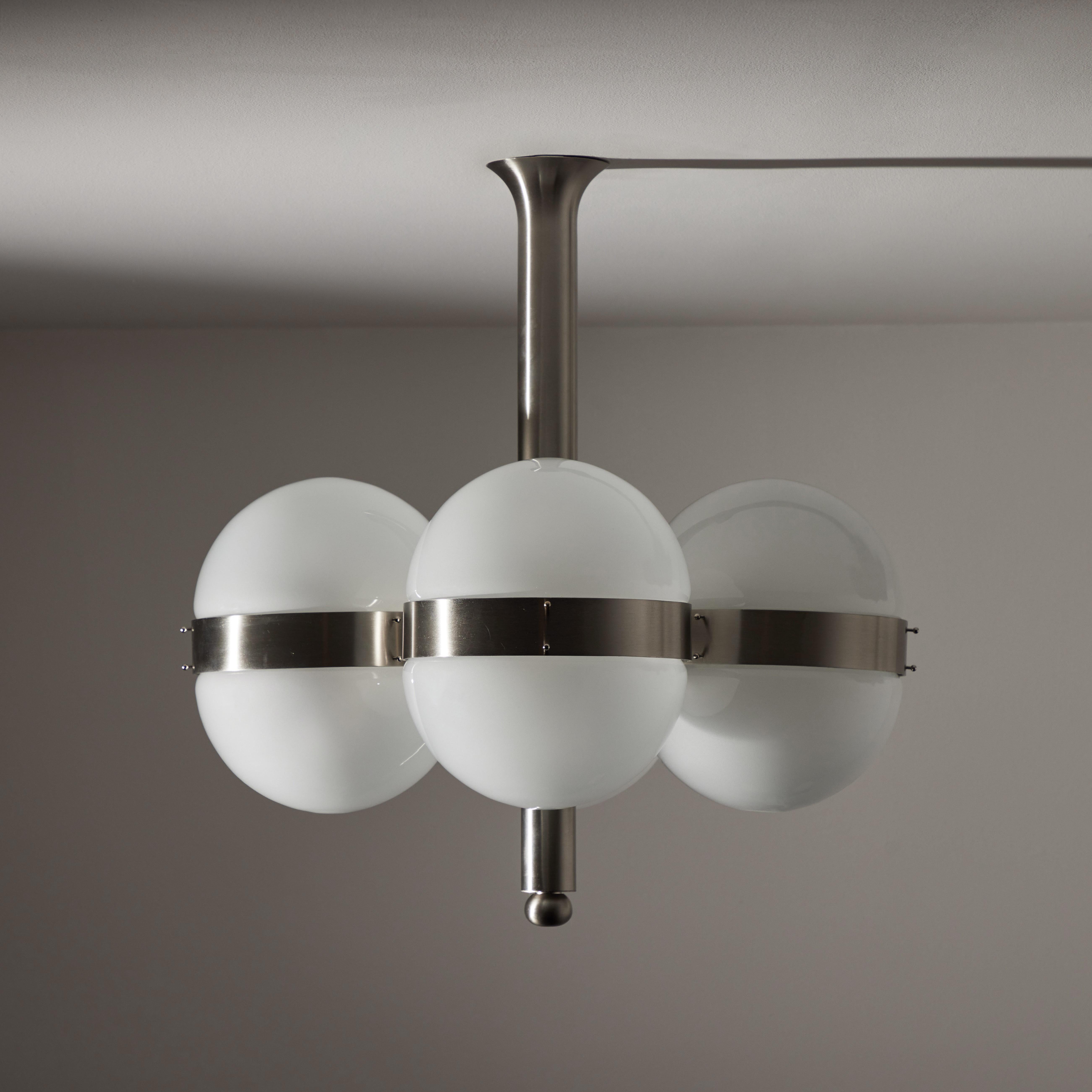 “Tetraclio” chandelier by Sergio Mazza for Artemide. Designed and manufactured in Italy circa the 1960s. Satin nickel parts hold etched glass diffusers. Wired for the US. Holds eight E27 medium base sockets. Recommended 30w max bulbs. Bulbs provided