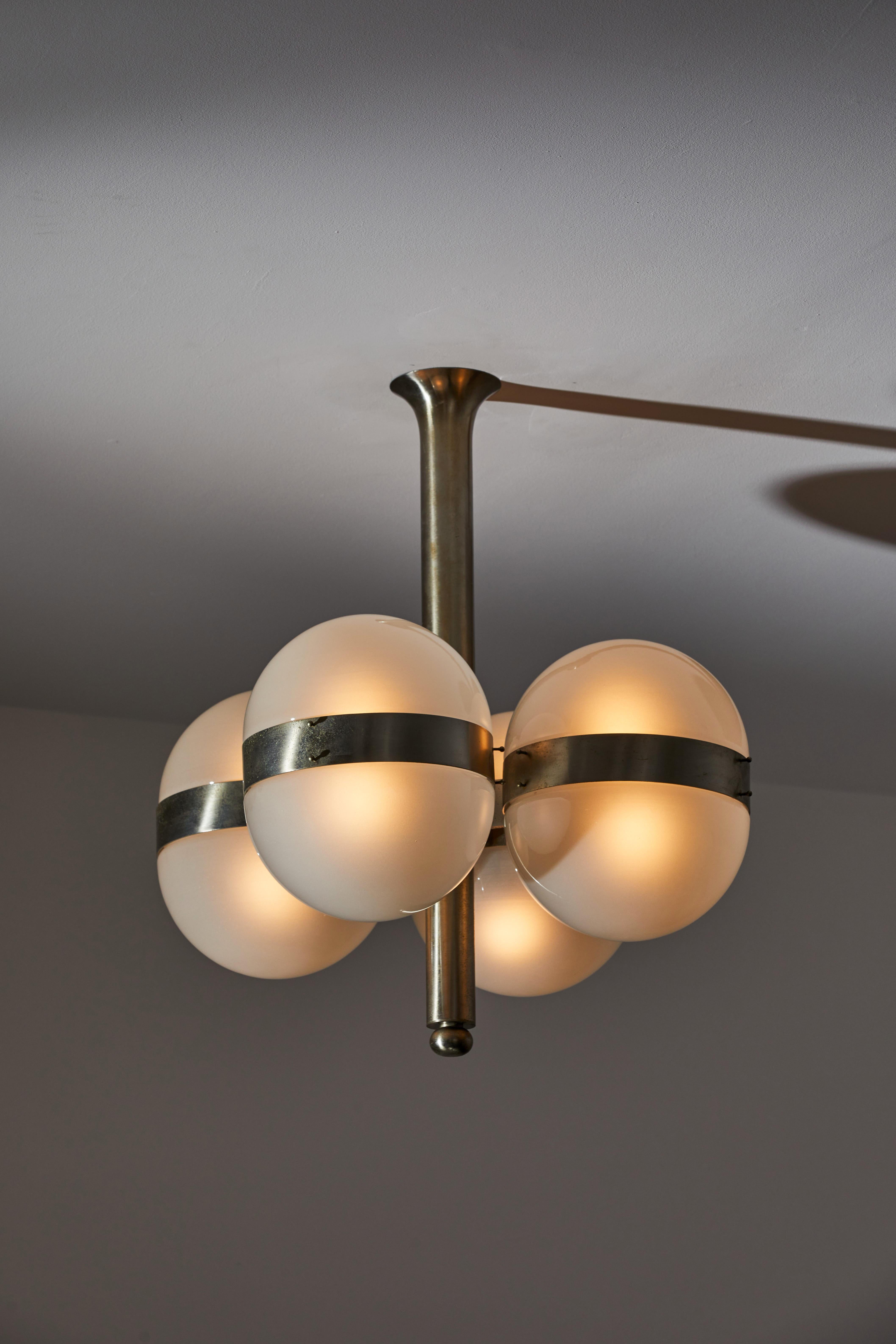 Two Tetraclio suspension lights by Sergio Mazza for Artemide. Designed and manufactured in Italy, 1961. Nickel-plated brass, opaline glass. Rewired for U.S. standards. Takes eight E27 60w maximum bulbs. Bulbs not included. Literature: Catalogo