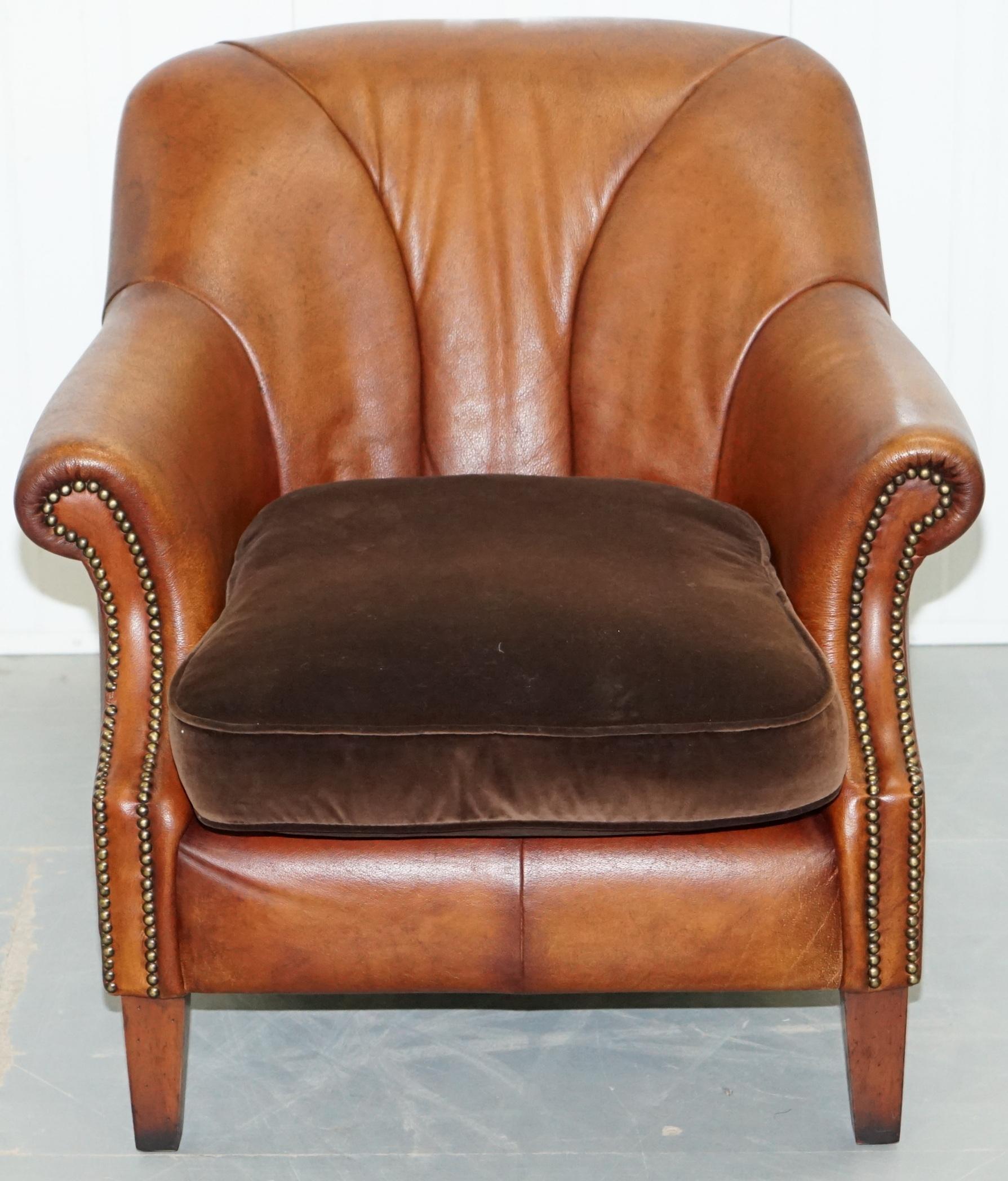 We are delighted to offer for sale this lovely buffalo leather shell back armchair with brown velvet feather filled cushion made by Tetrad England and retailed through John Lewis

A very popular and now discontinued chair, the buffalo leather is