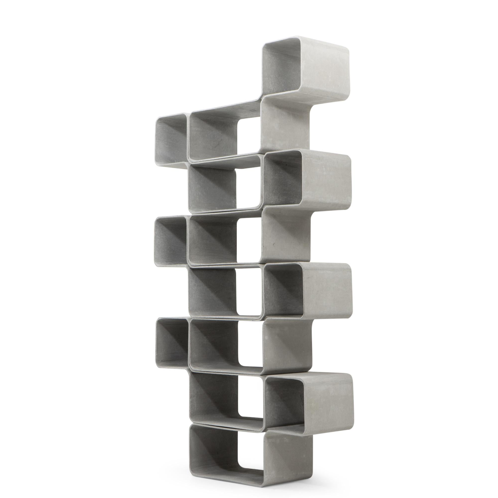 A modular Tetris storage unit designed by Kevin Fries and Jakob Zumbühl in the 2000s for Eternit (Switzerland). The piece is made from a fibrous cement like material, a material characteristic of Eternit’s furniture production, valued for its