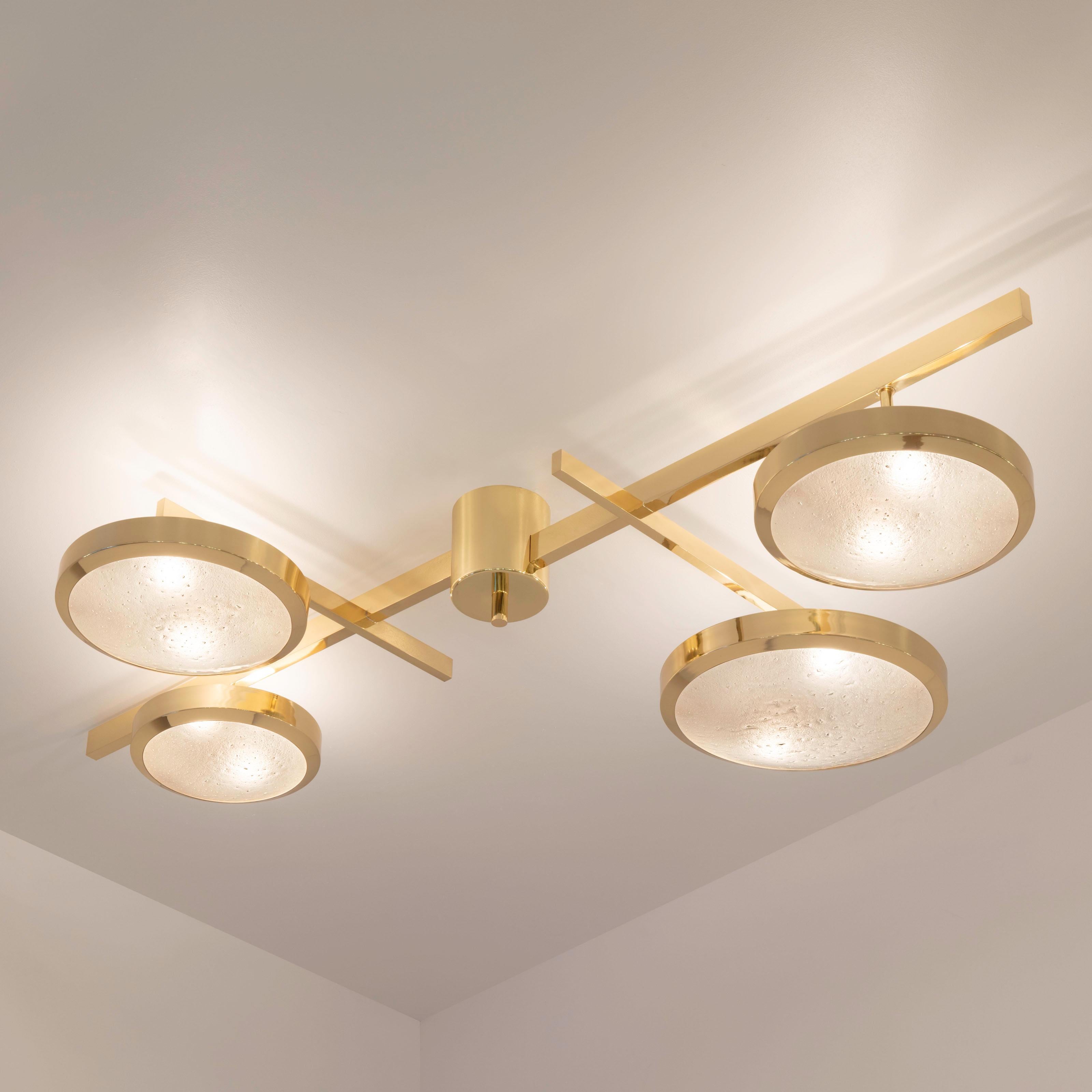 The Tetrix ceiling light features a composition of variable sized Murano glass shades on a brass machined frame highlighting perpendicular and intersecting lines. The first images show the fixture in our polished brass finish-subsequent pictures