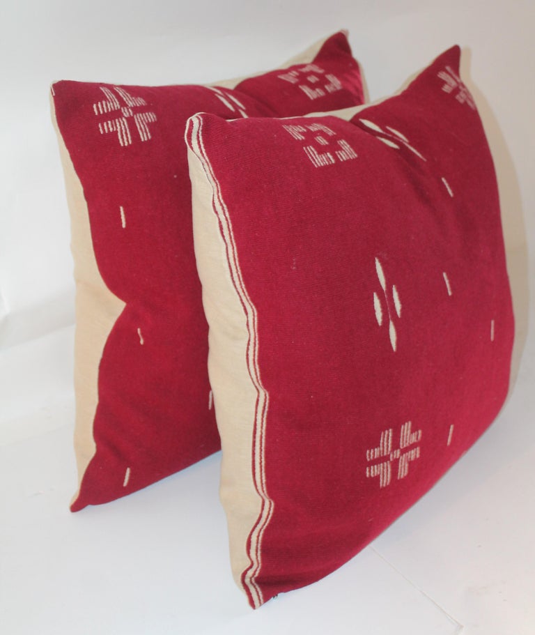 These most unusual burgundy and white Indian design pillows are in fine condition. The backing is in cream cotton linen. Down and feather fill.