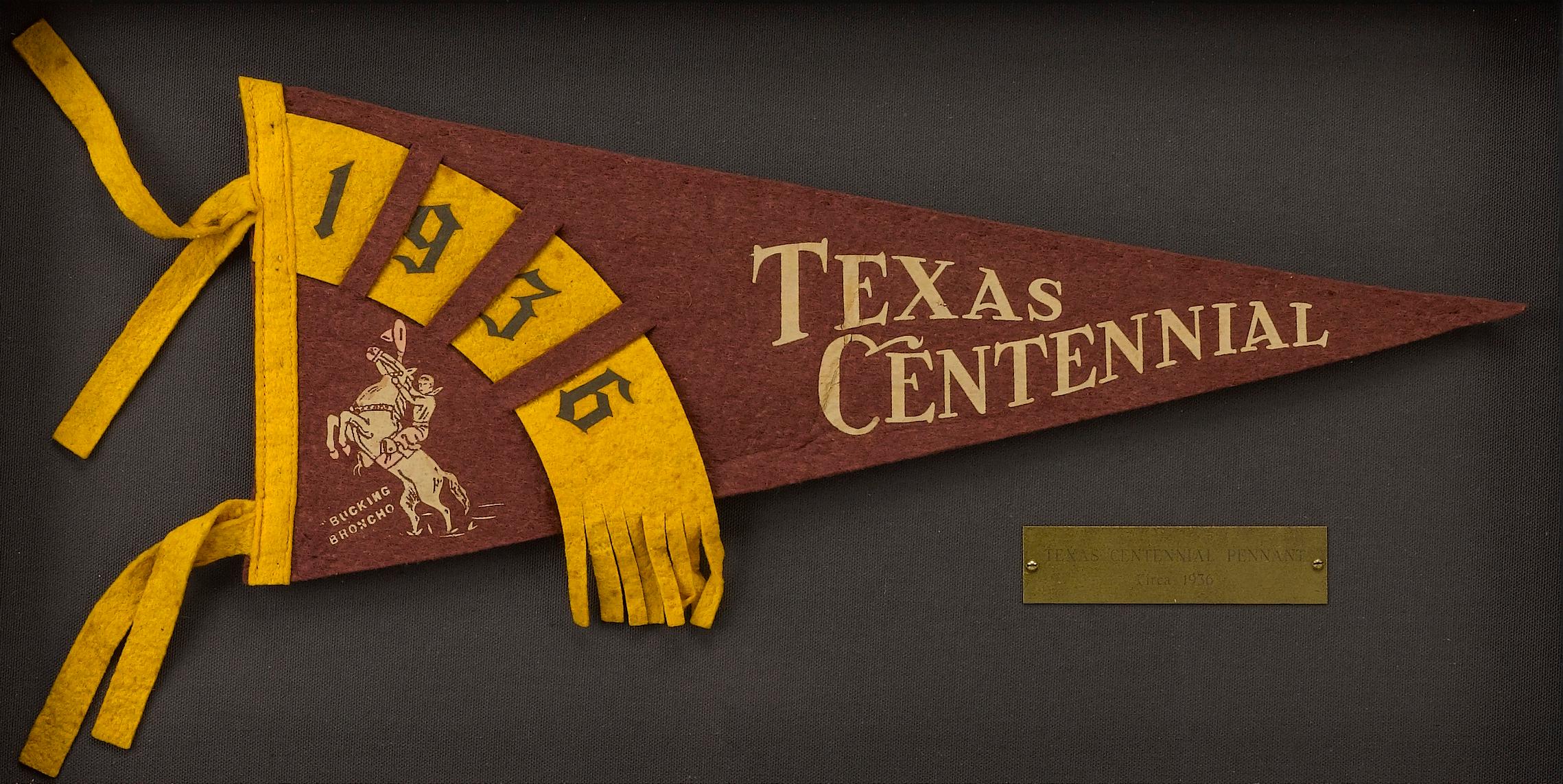 This is an original vintage Texas Centennial Pennant, from 1936. The felt pennant has a rich burgundy field, white script that reads 