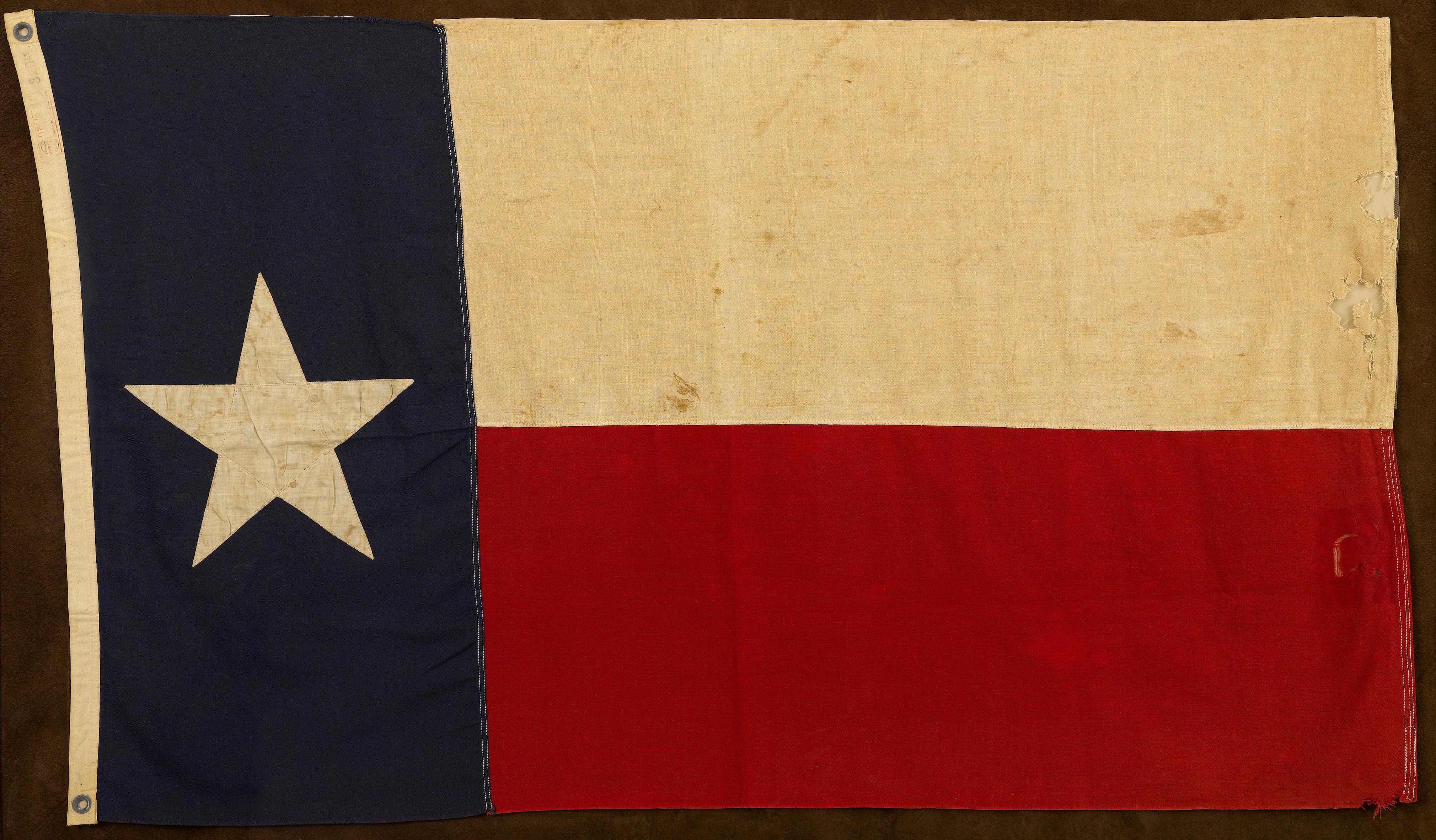 This is vintage Texas state flag, produced by Annin Flag Company in the 1930s. The flag is sewn and measures 3 ft x 5 ft. 

Texas passed its Flag Act in 1933, describing the exact specifications for its flag. The Flag Act named blood red, azure