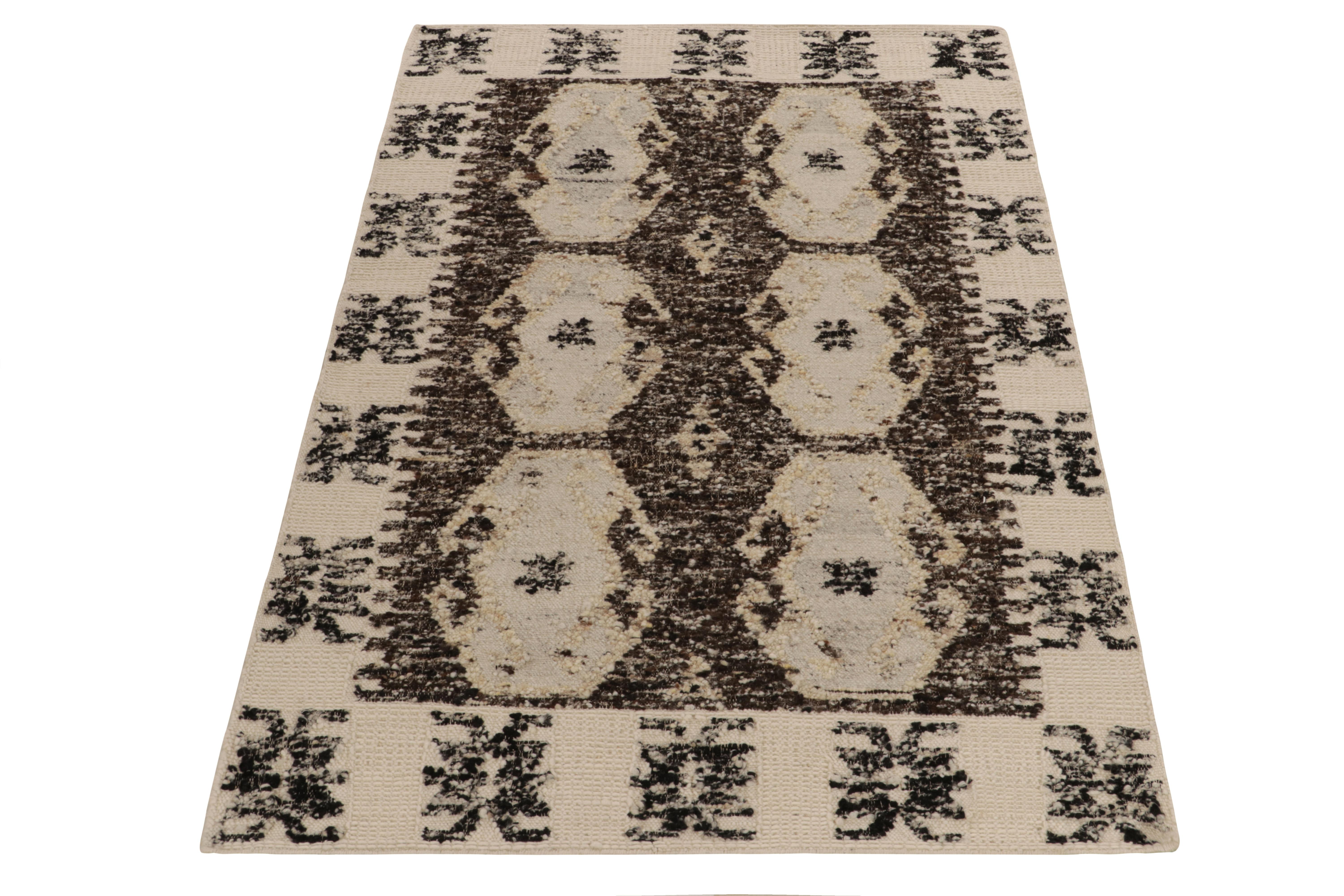 Connoting a bold take on classic aesthetics, Rug & Kilim unveils this 5x8 contemporary flat weave with a distinctive approach in style & technique. The Kilim rug features a well defined geometric pattern in a beige-brown colorway with subtle hints
