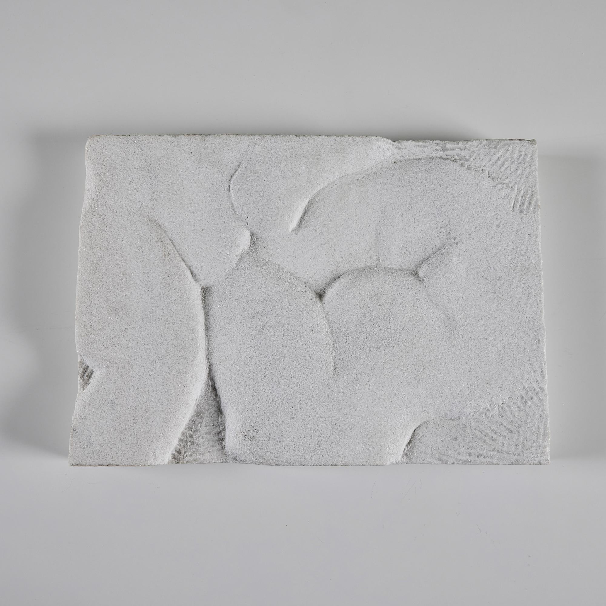 Playful stone stab with textural design. This rectangular slab can easily be displayed on a table or leaning on a shelf. It showcases an abstract design of rounded curves.

Dimensions 
17.5