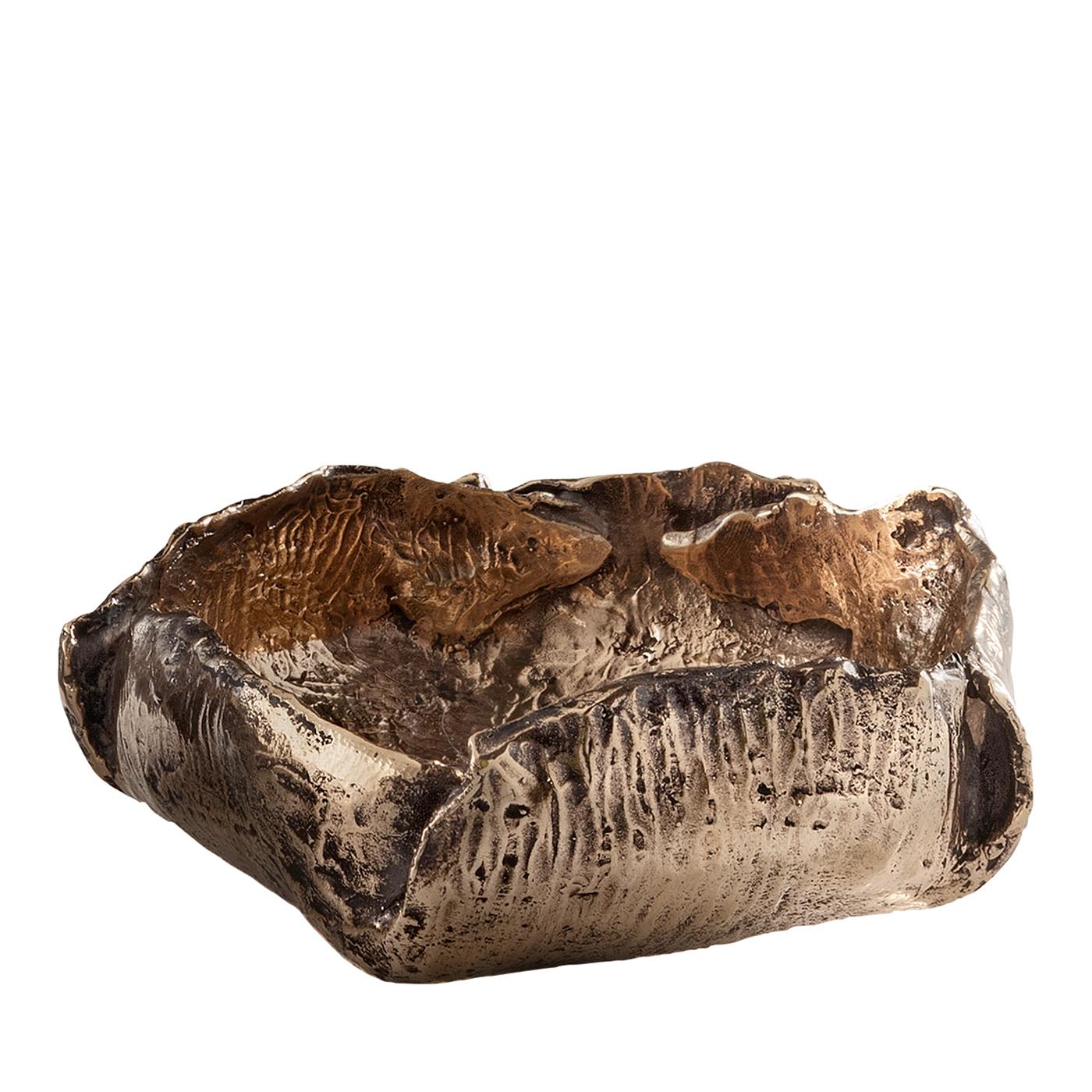 Unusual bronze bowl handcrafted by Osanna Visconti using the traditional lost-wax casting technique. Misshapen and fragmented, this signature décor piece resembles a coral reef or fossil due to its unusual forms, textures, and varying shades of