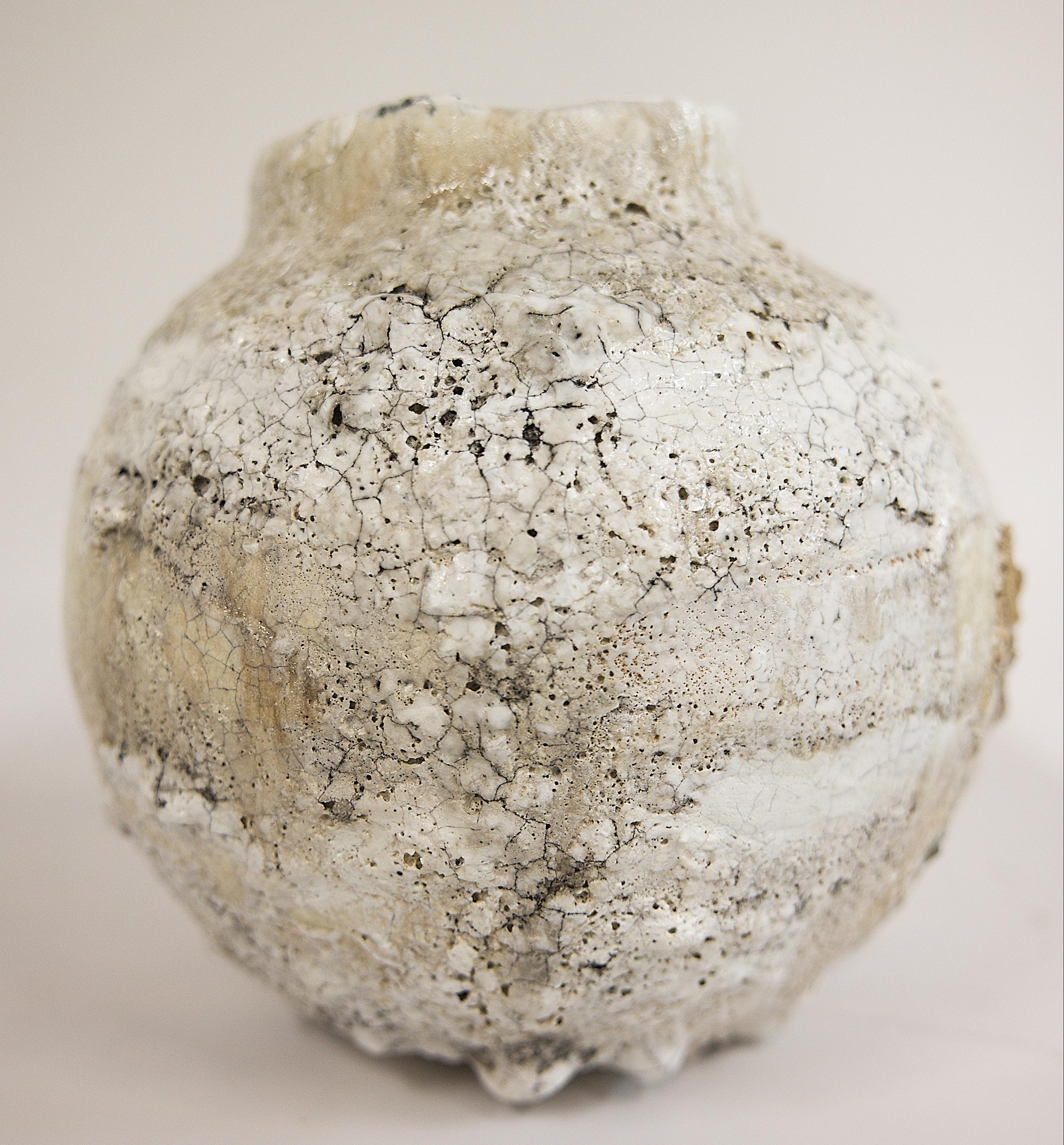 Featuring custom glazes, a unique matte white crackle base, and lava-covered texture, two Moon vases with wider opening one is 9