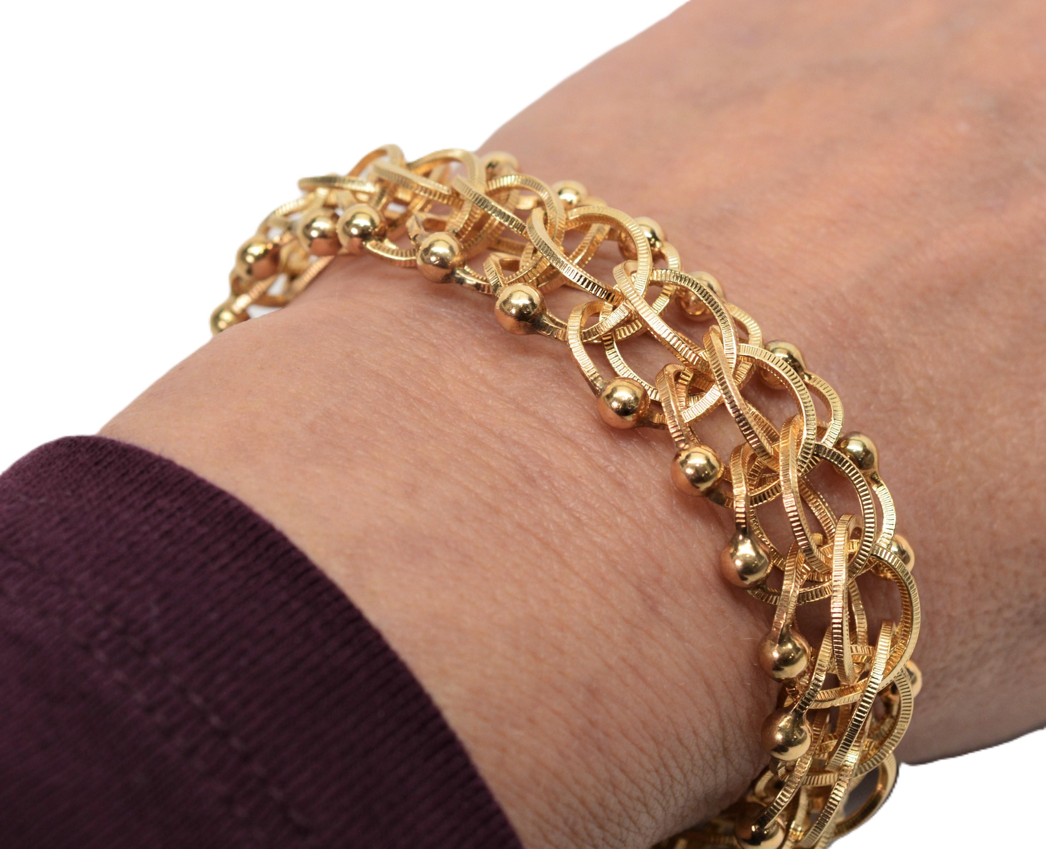 Rétro Bracciale a catena aperta a maglie intrecciate in oro giallo 14 kt. in vendita