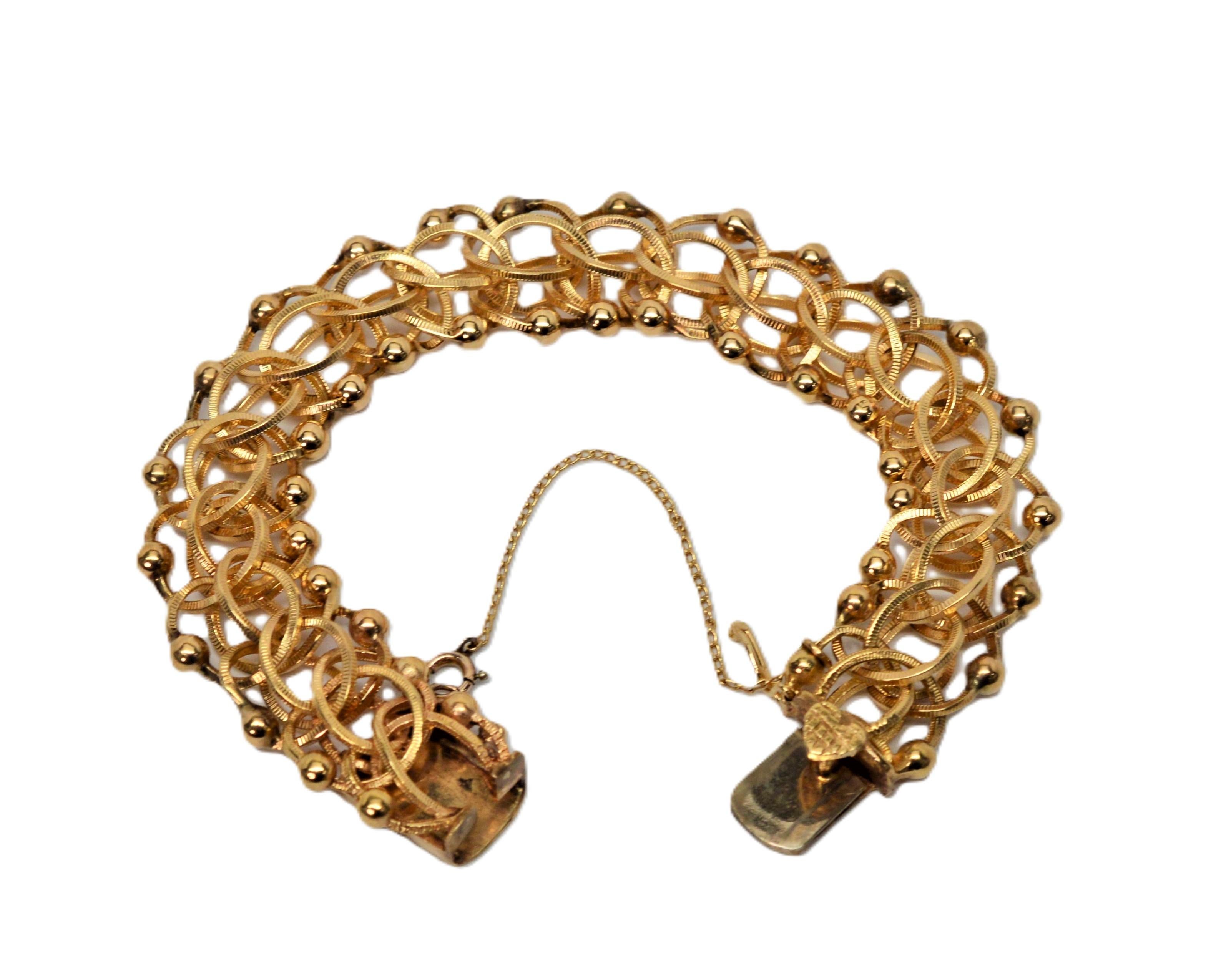 Bracciale a catena aperta a maglie intrecciate in oro giallo 14 kt. in vendita 1