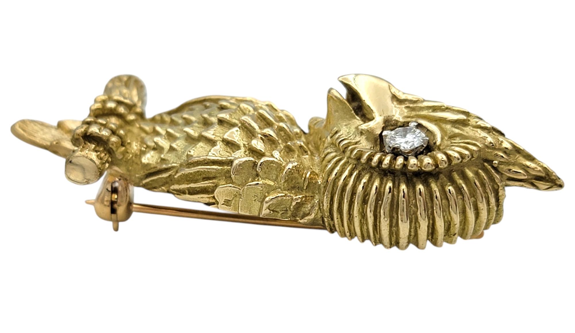 Contemporary Textured 14 Karat Yellow Gold Winking Owl Brooch with Round Diamond Eye For Sale
